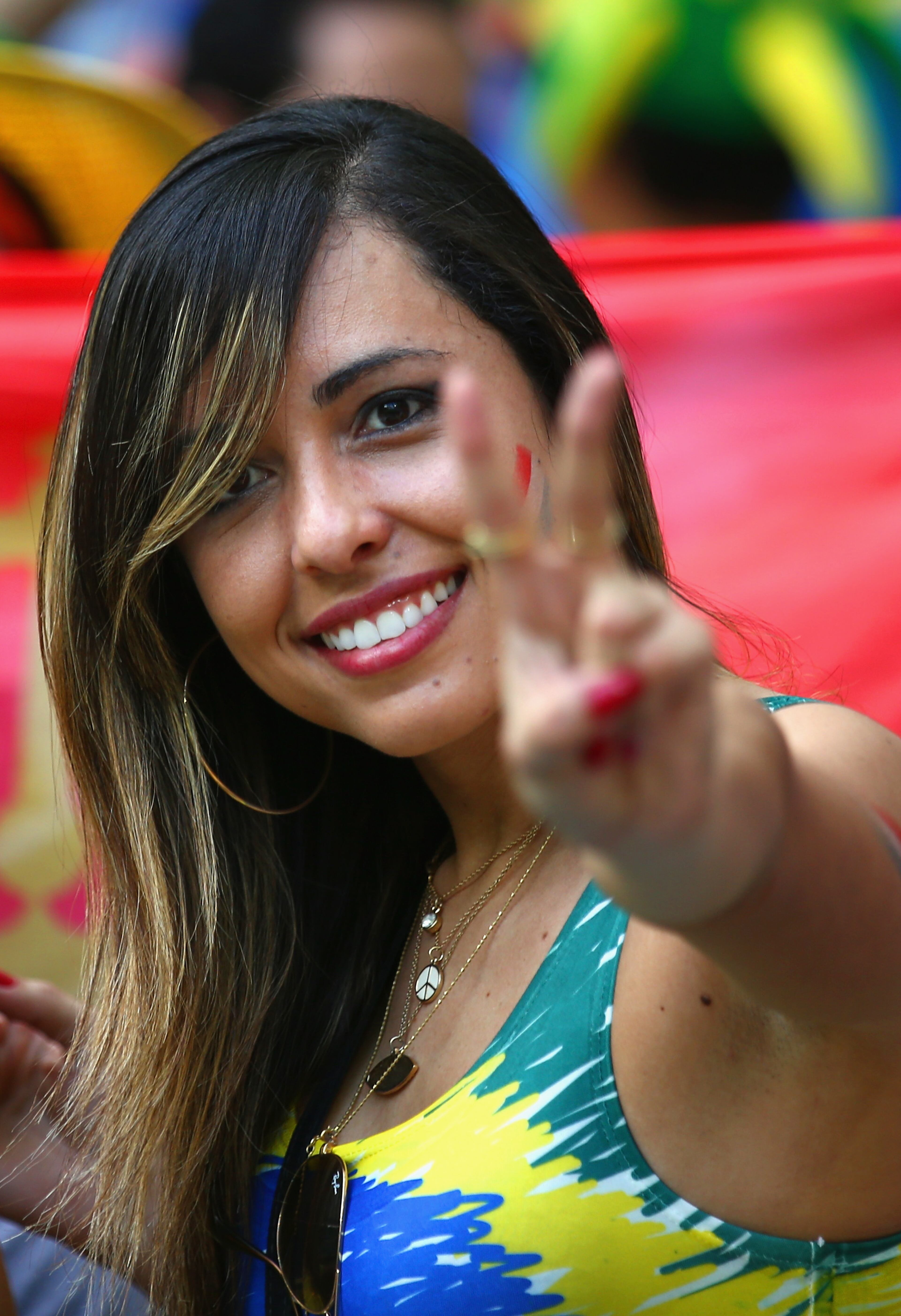 SALVADOR, BRAZIL - JUNE 13: A fan gives a peace sign before the 2014 FIFA World Cup Brazil Group B match between Spain and Netherlands at Arena Fonte Nova on June 13, 2014 in Salvador, Brazil. (Photo by Ian Walton/Getty Images)