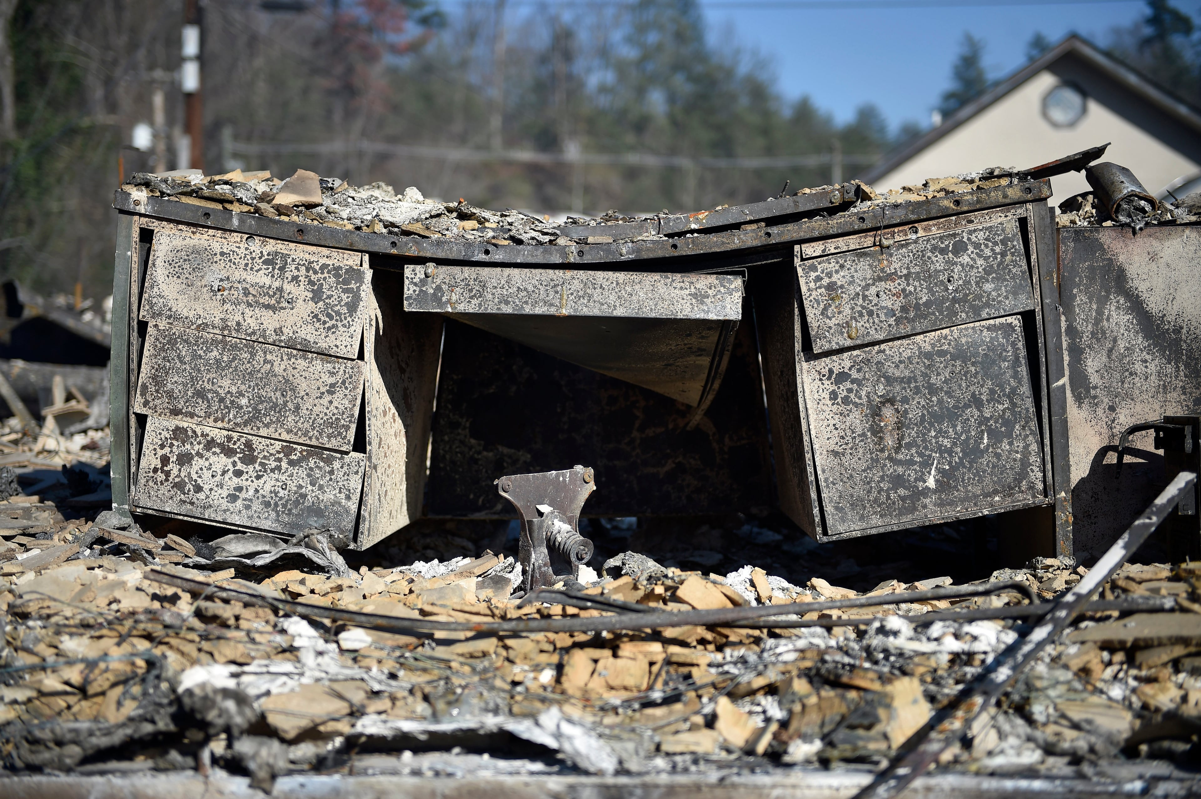 A melted desk rests inside a destroyed building, Tuesday, Nov. 29, 2016, in Gatlinburg, Tenn., after a wildfire swept through the area Monday. (Andrew Nelles/The Tennessean via AP)