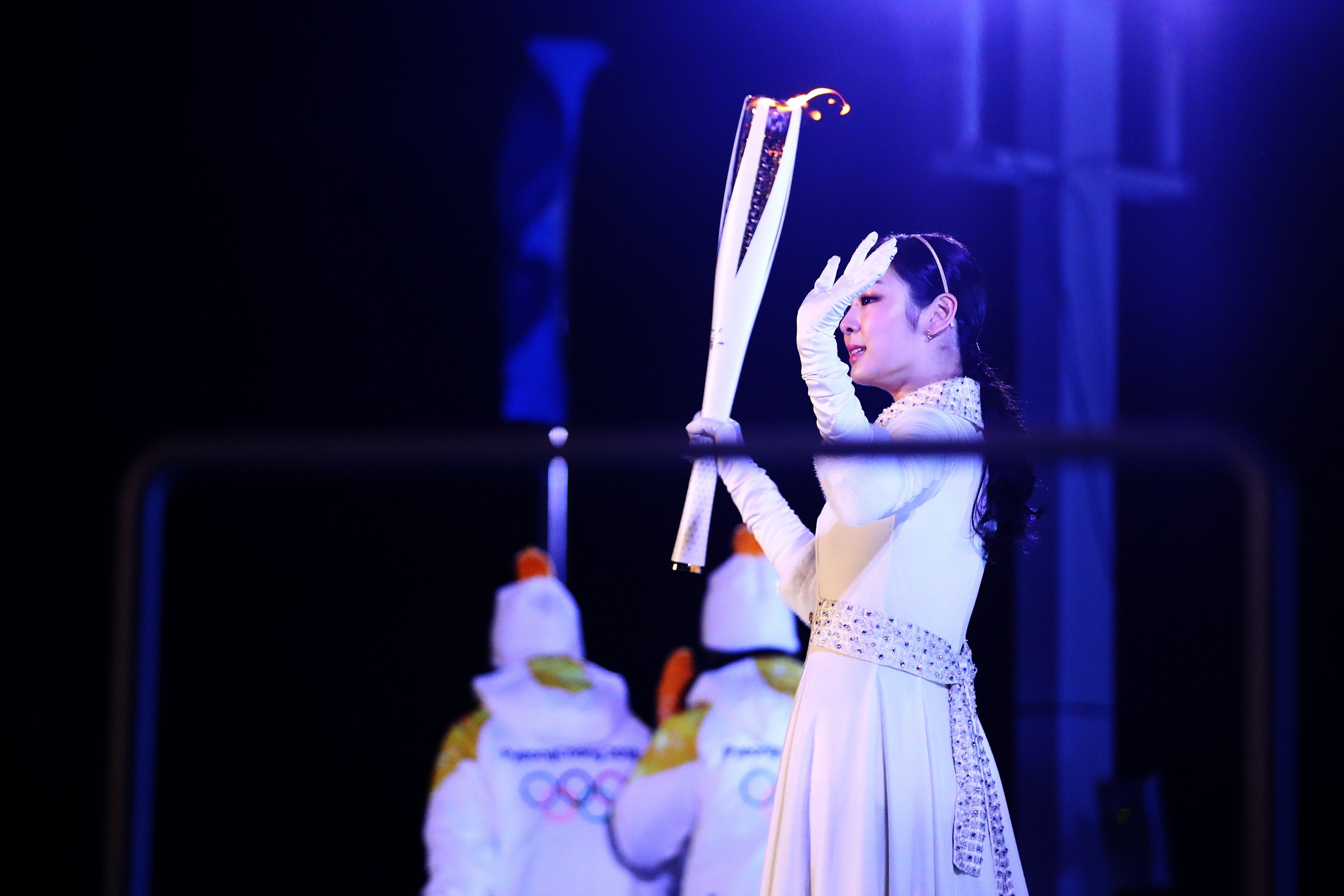 PYEONGCHANG-GUN, SOUTH KOREA - FEBRUARY 09: Kim Yu-na, South Korean Figure Skater lights the cauldron during the Opening Ceremony of the PyeongChang 2018 Winter Olympic Games at PyeongChang Olympic Stadium on February 9, 2018 in Pyeongchang-gun, South Korea. (Photo by Dean Mouhtaropoulos/Getty Images)