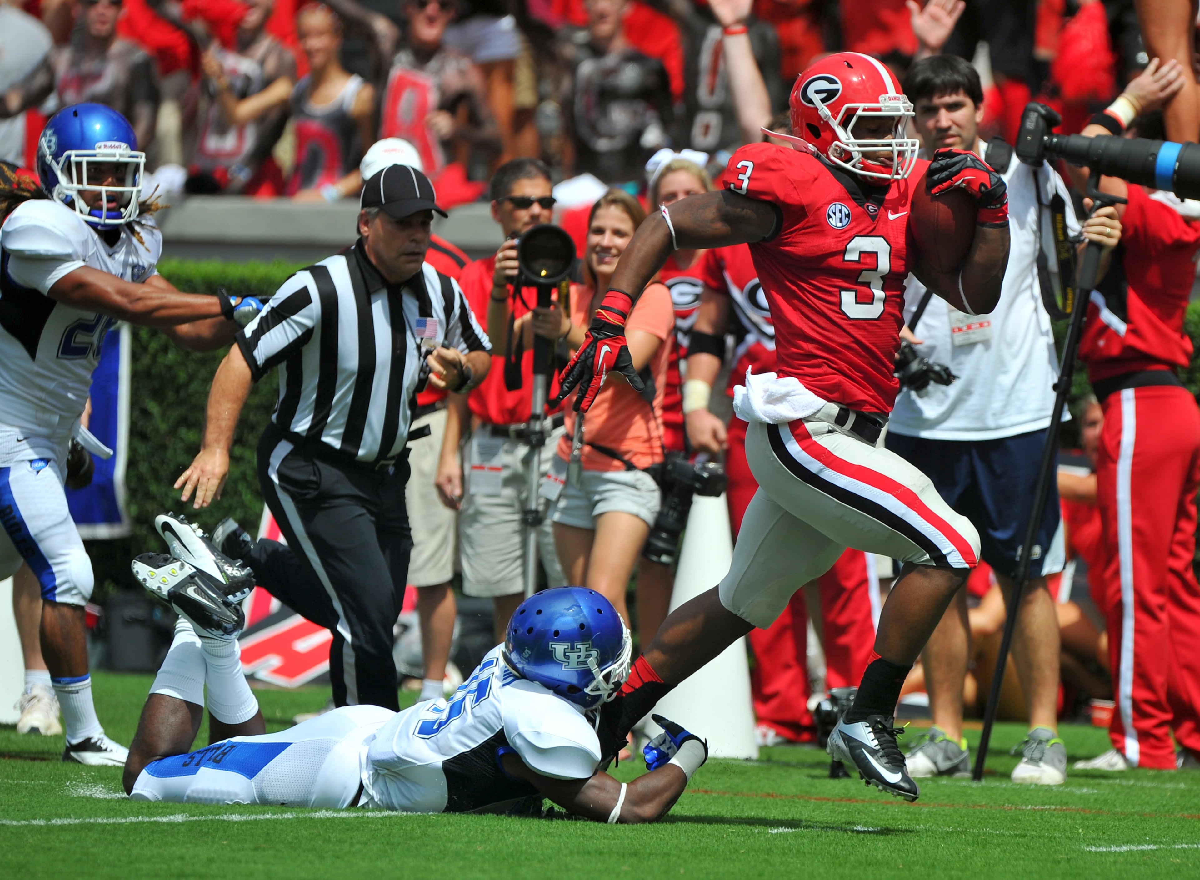Gurley eludes the tackle of Buffalo defensive back Derek Brim in route to a 100-yard touchdown kickoff return September 1, 2012 at Sanford Stadium.