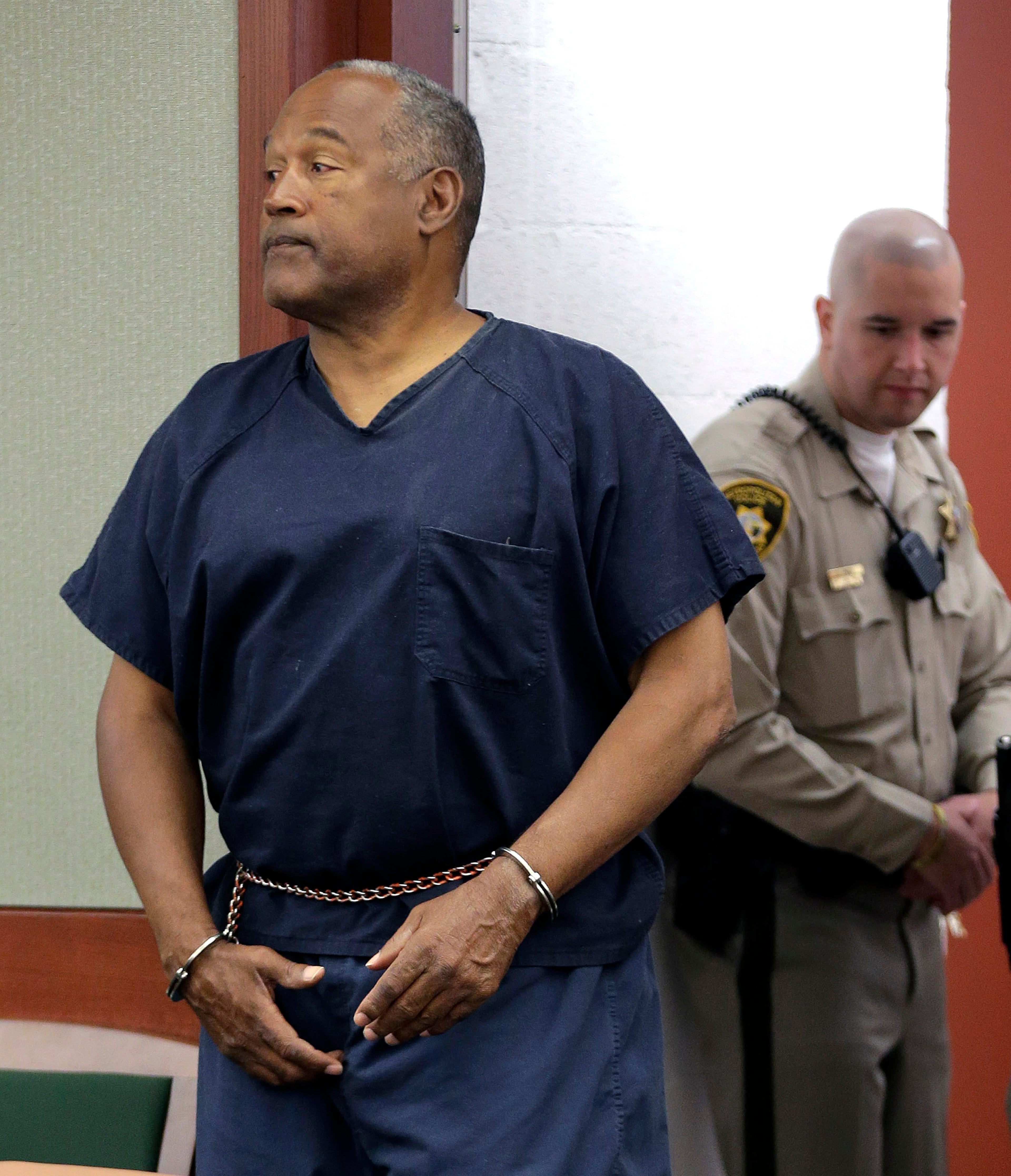 LAS VEGAS, NV - MAY 13: O.J. Simpson enters the courtroom for his retrial in Clark County District Court May 13, 2013 in Las Vegas, Nevada. Simpson, who is currently serving a nine to 33-year sentence in state prison as a result of his October 2008 conviction for armed robbery and kidnapping charges, is using a writ of habeas corpus, to seek a new trial, claiming he had such bad representation that his conviction should be reversed. (Photo by Julie Jacobson - Pool/Getty Images)