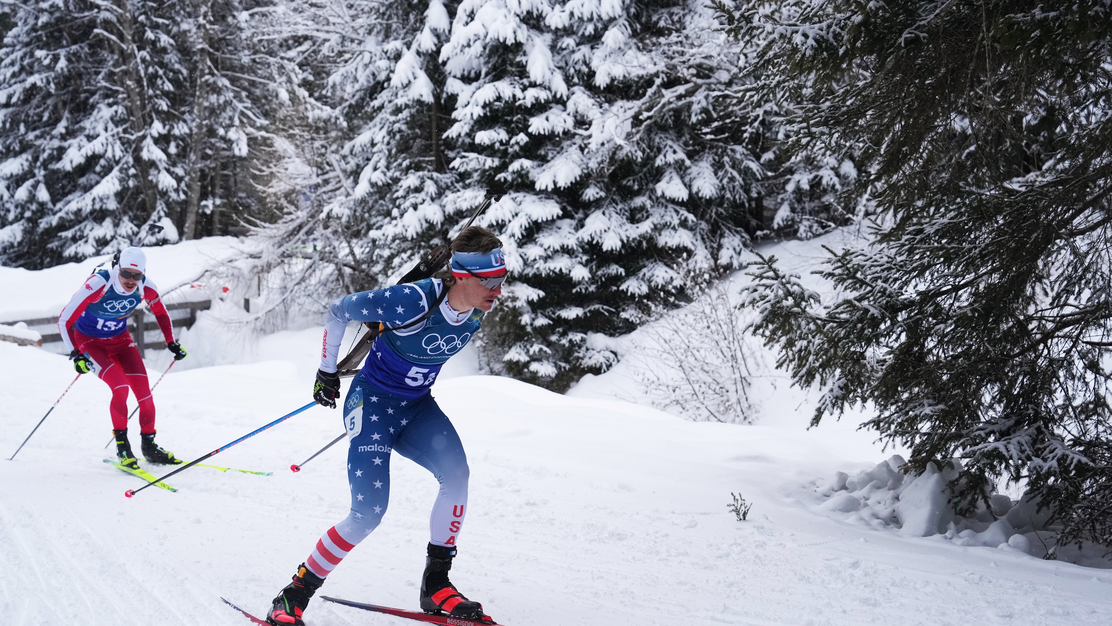 FILE - Campbell Wright, of the United States, right, competes in the men's 4x7.5-kilometer relay biathlon race at the 2026 Winter Olympics in Anterselva, Italy, Feb. 17, 2026. (AP Photo/Andrew Medichini, File)