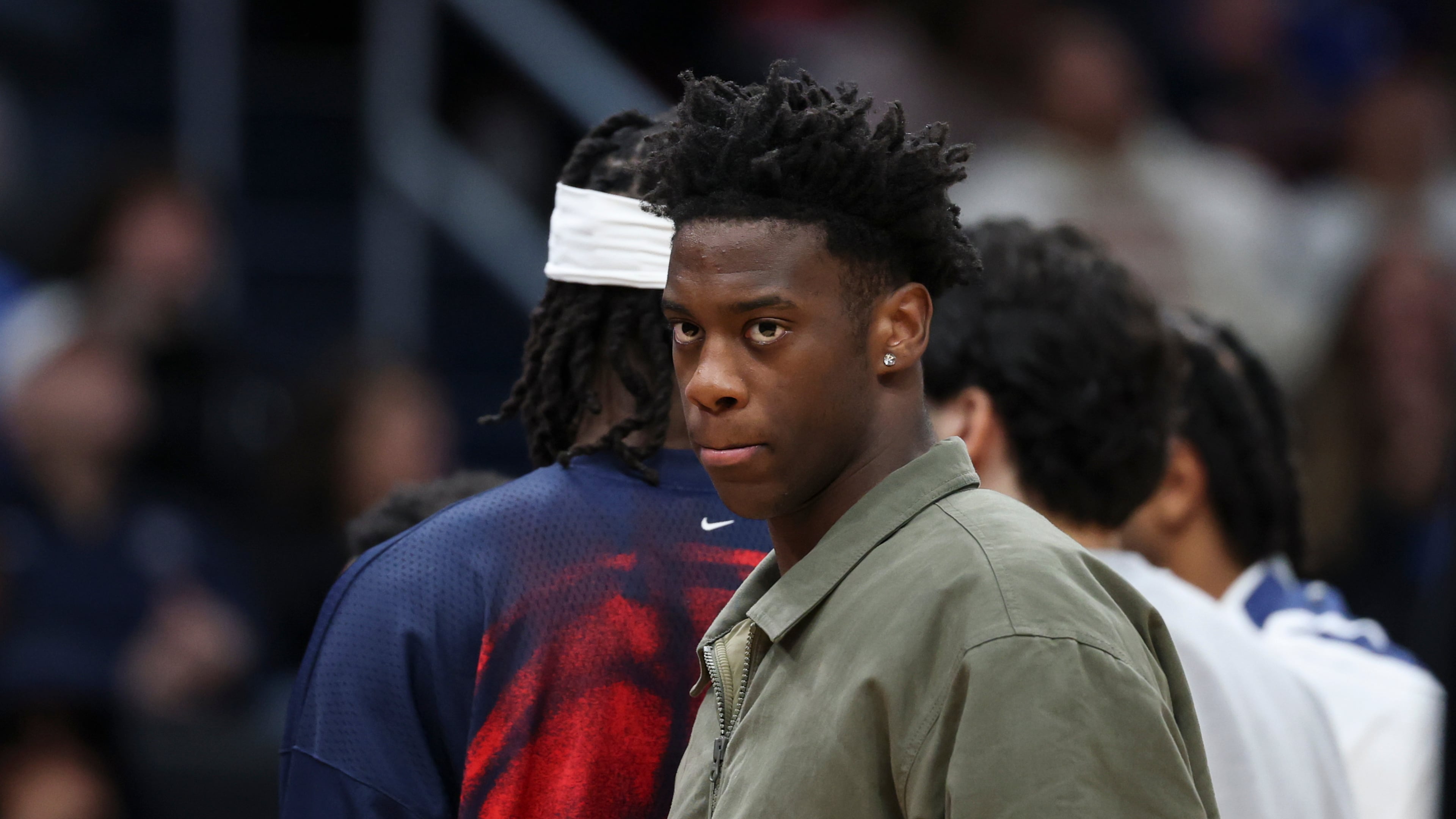 Washington Wizards forward AJ Dybantsa looks on while wearing street clothes during an NBA basketball game against the Toronto Raptors in Washington, Friday, Oct. 23, 2026. (AP Photo/Terrance Williams)