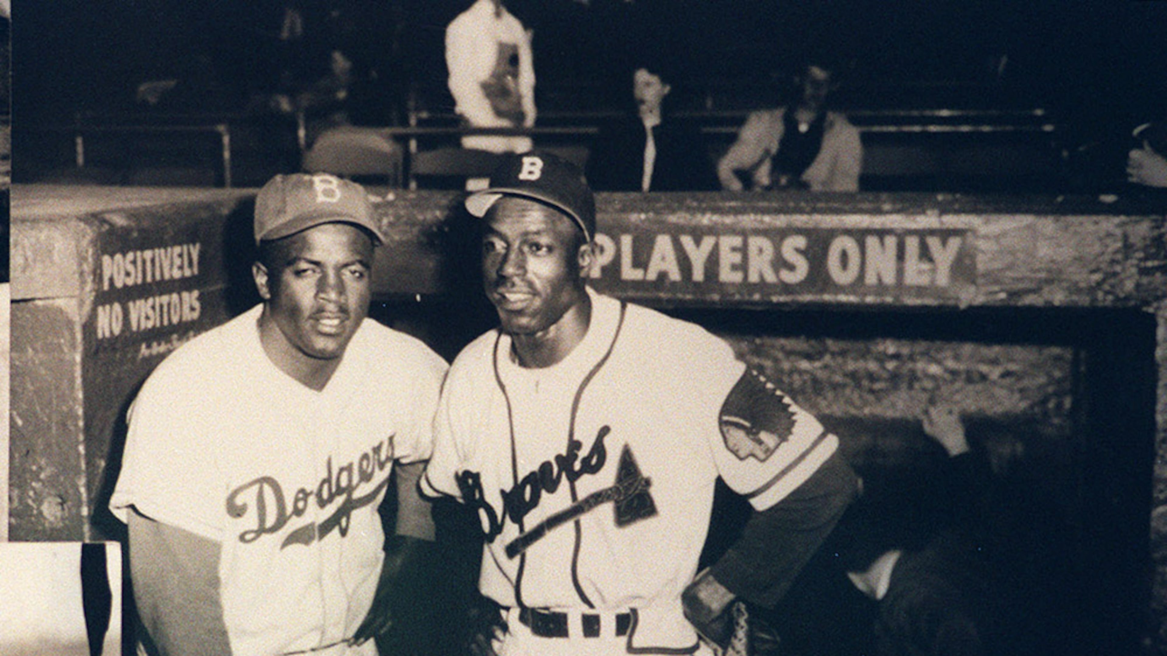 A copy of a photo from the Braves Museum at Turner Field of Jackie Robinson, left, with Sam "Jet" Jethro, the first African American to play for the Braves, joining the team in 1950. (Taimy Alvarez/The Atlanta Journal-Constitution)