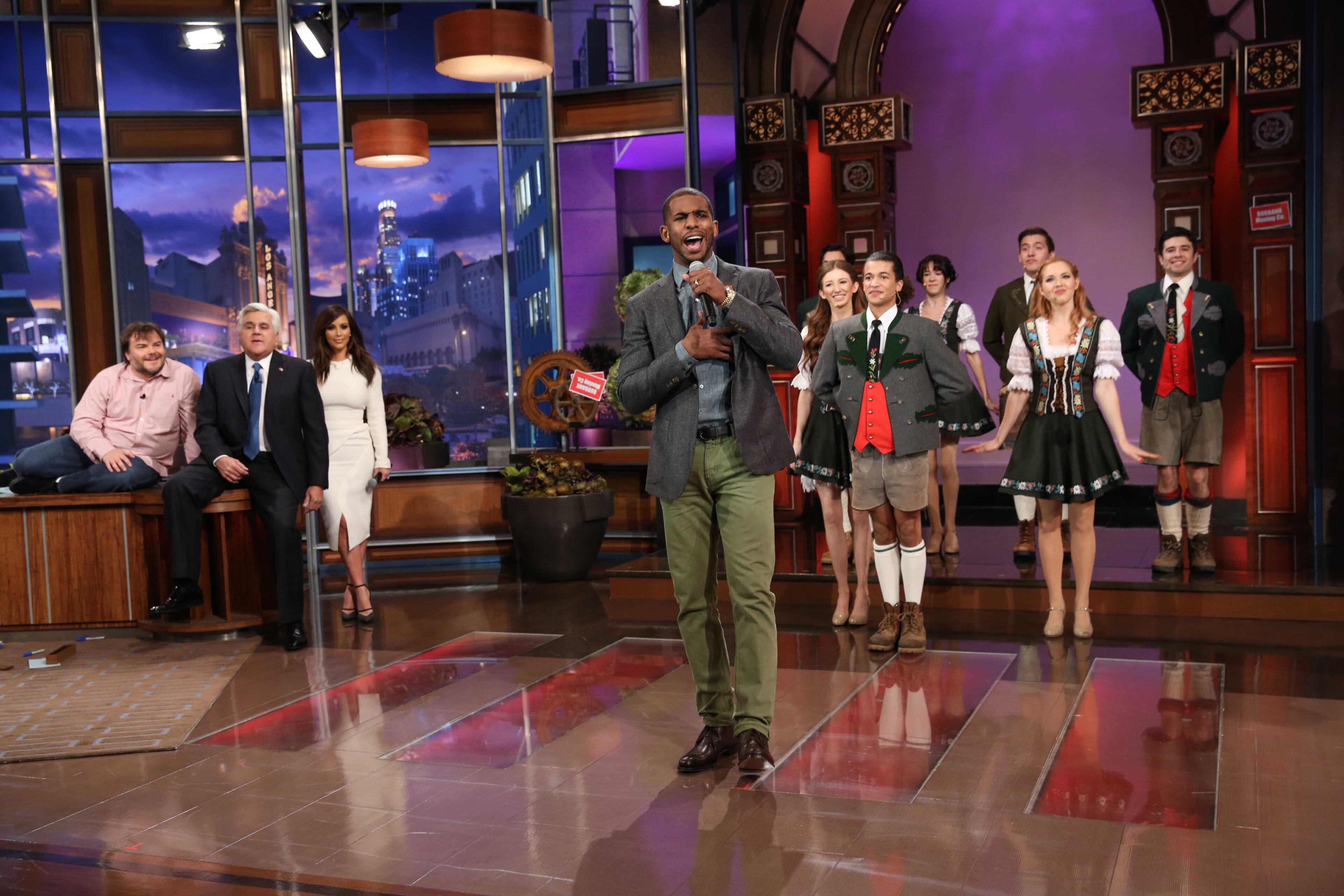 In this photo provided by NBC, from left, Jack Black, host Jay Leno and Kim Kardashian watch as basketball player Chris Paul performs during the "Farewell Song" on Jay Leno's final episode of "The Tonight Show," Thursday, Feb. 6, 2014, in Burbank, Calif. (AP Photo/NBC, Chris Haston)