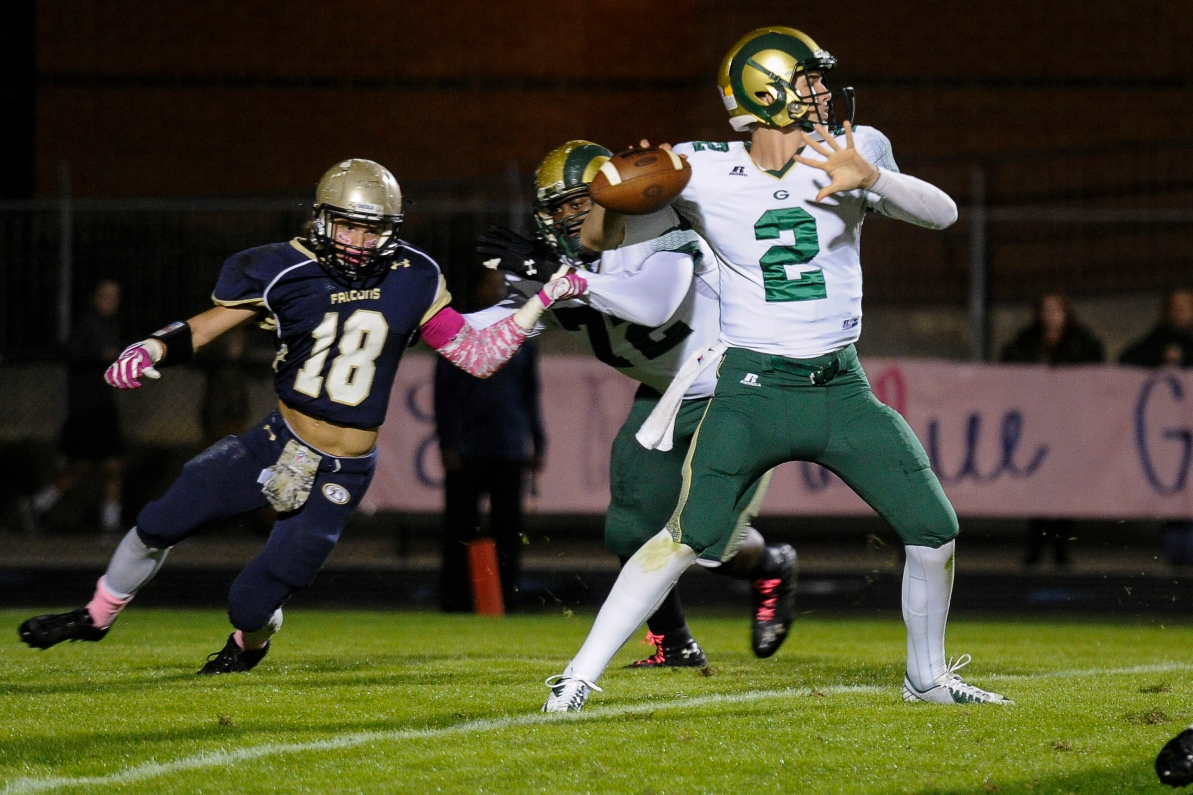 Grayson quarterback Chase Brice (2) passes as Dacula linebacker Lawson Cook (18) pressures him with blocking by Jalen Jackson during their high school football game in Dacula, Friday, Oct. 24, 2014. (John Amis / SPECIAL)