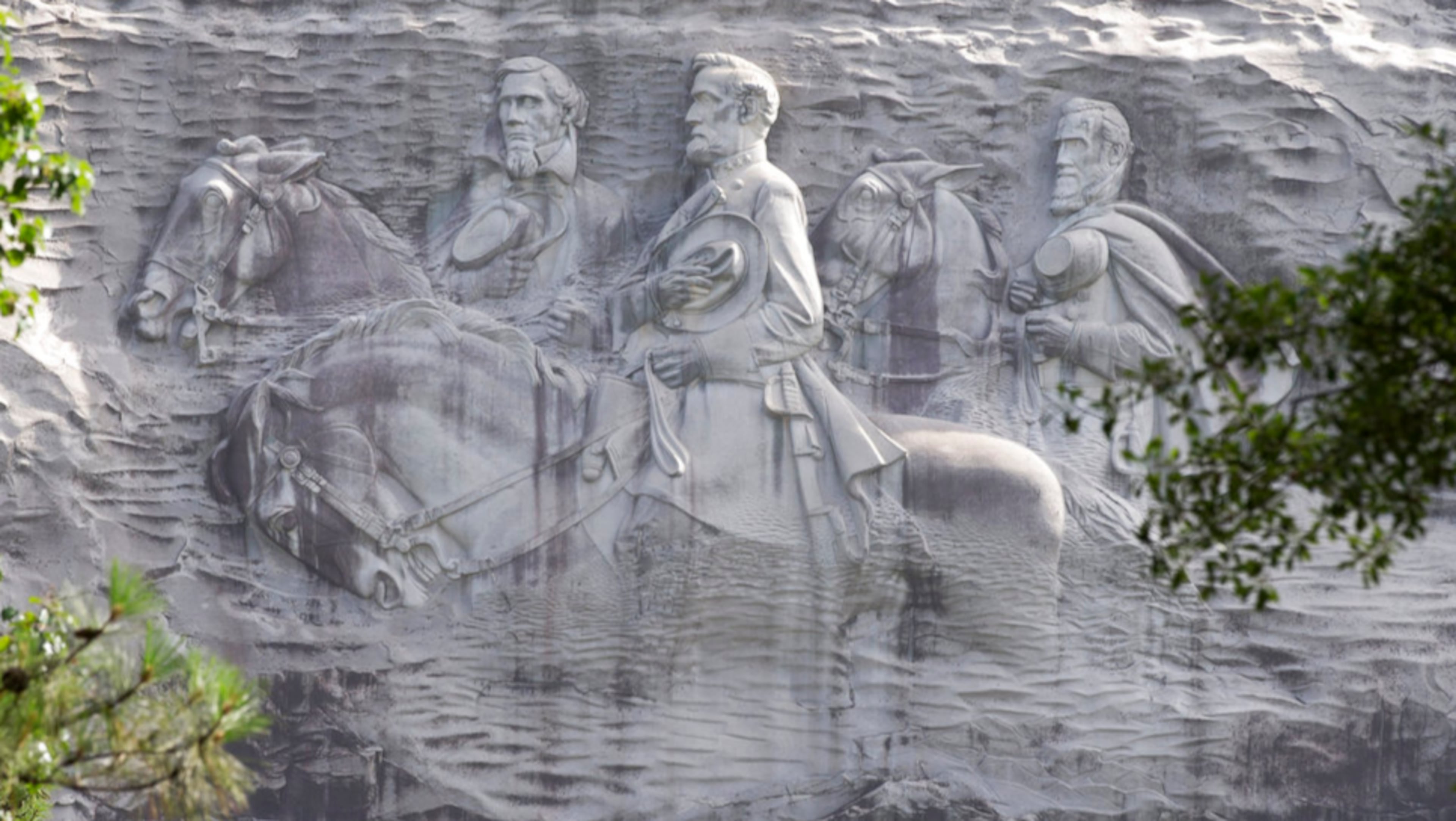 This June 23, 2015, file photo shows a carving depicting confederates Stonewall Jackson, Robert E. Lee and Jefferson Davis, in Stone Mountain, Georgia. (John Bazemore/AP)