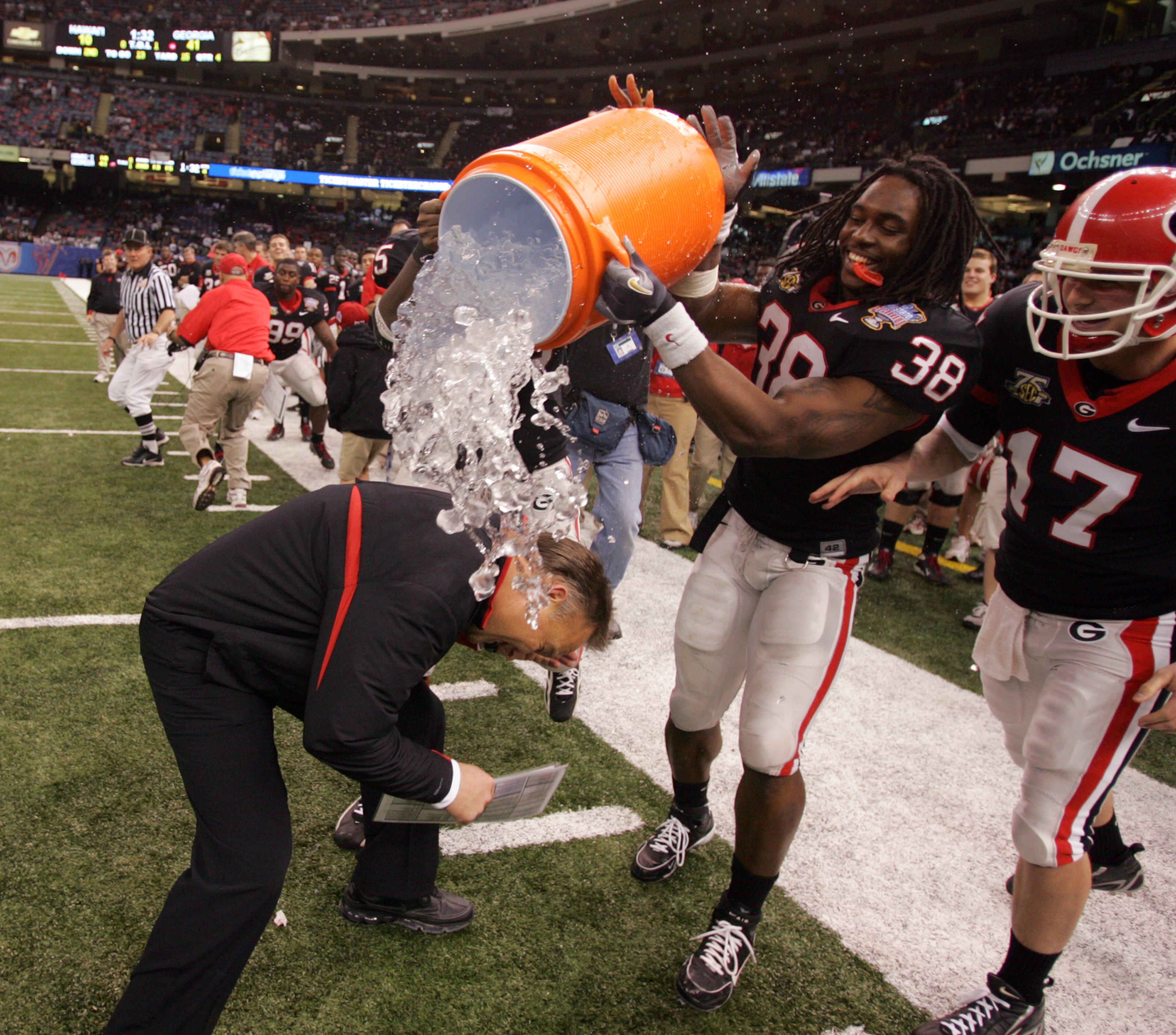 Georgia coach Mark Richt tries to dodge the water being thrown on him by defensive end Marcus Howard (38) in the fourth quarter of the rout of Hawaii in the Sugar Bowl on Jan. 1, 2008 in New Orleans. BRANT SANDERLIN / Staff