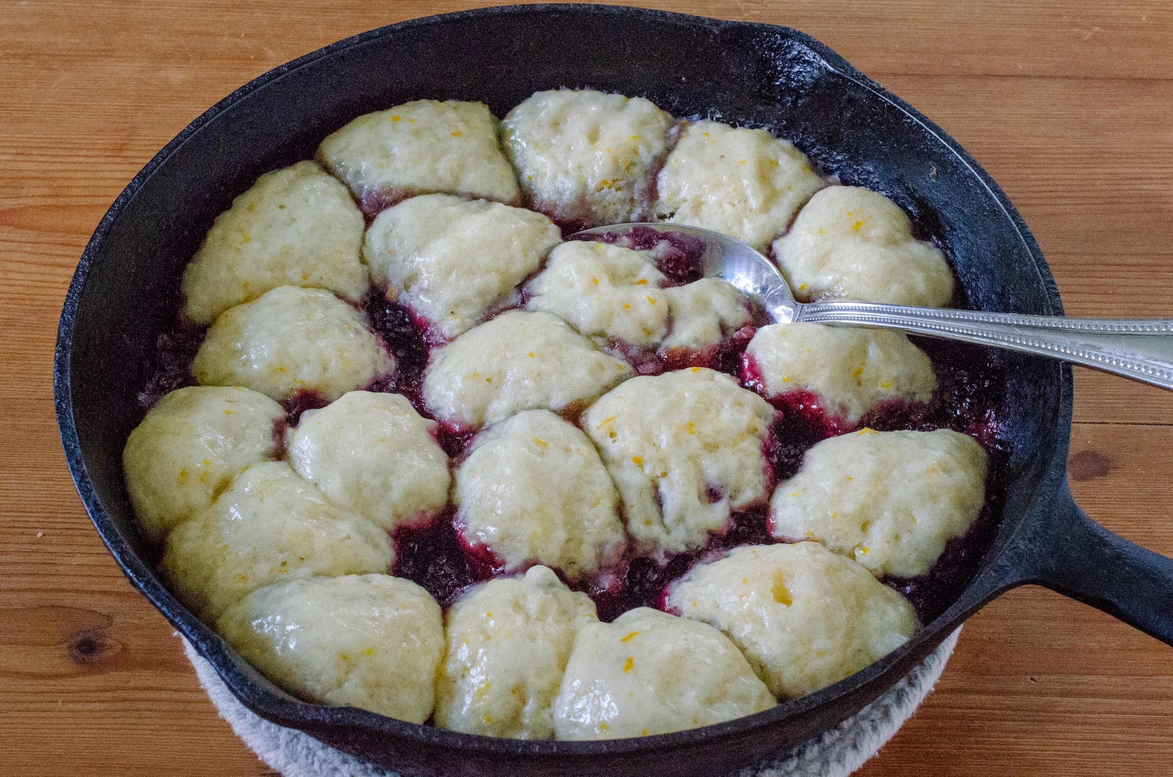 Blackberry Slump is a dish of sweetened biscuit dumplings steamed in stewed blackberries. (Virginia Willis for the AJC)