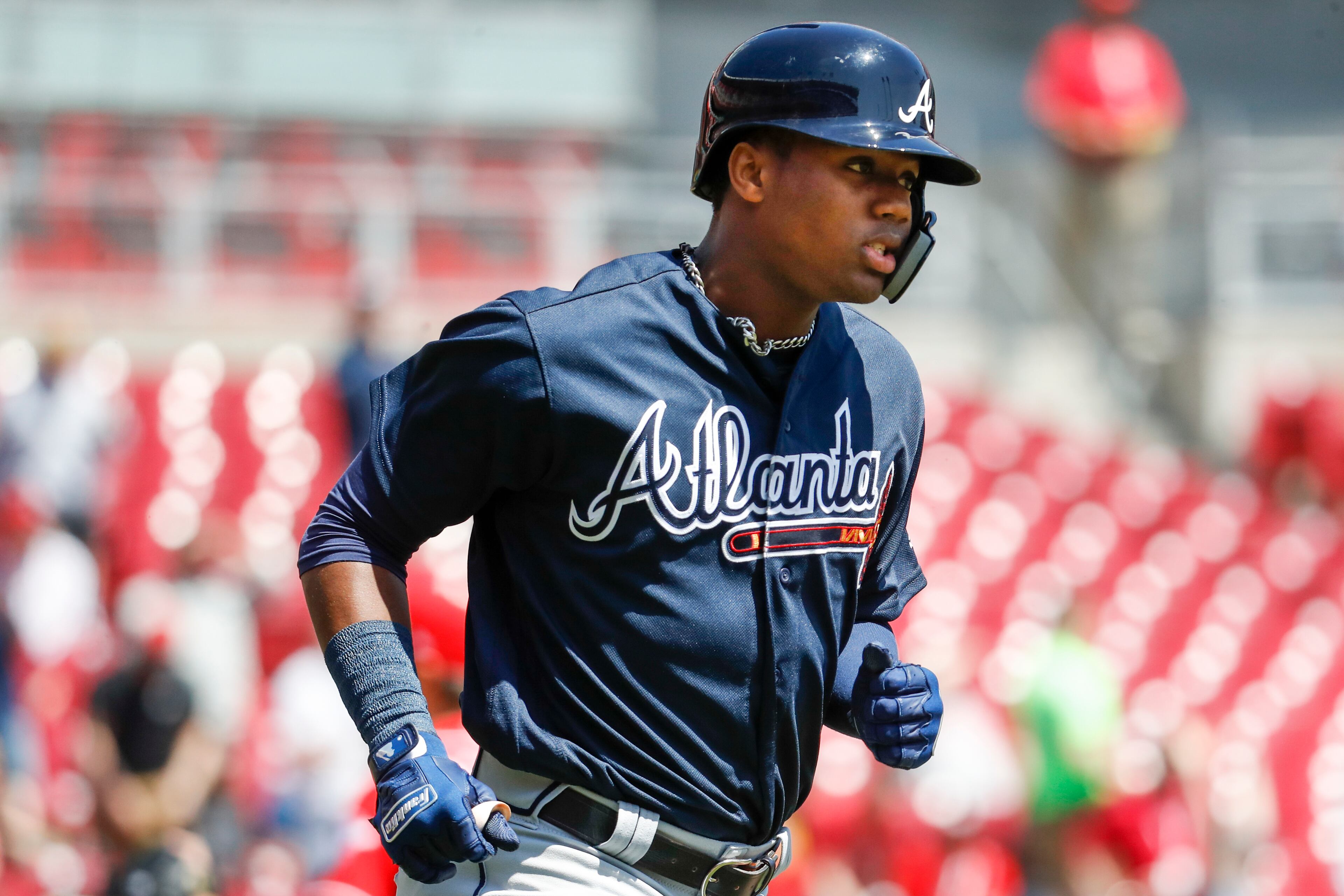 Atlanta Braves' Ronald Acuna Jr. runs the bases after hitting a solo home run off Cincinnati Reds starting pitcher Homer Bailey in the second inning of a baseball game, Thursday, April 26, 2018, in Cincinnati. Acuna recorded his second major league hit overall and his first home run. (AP Photo/John Minchillo)