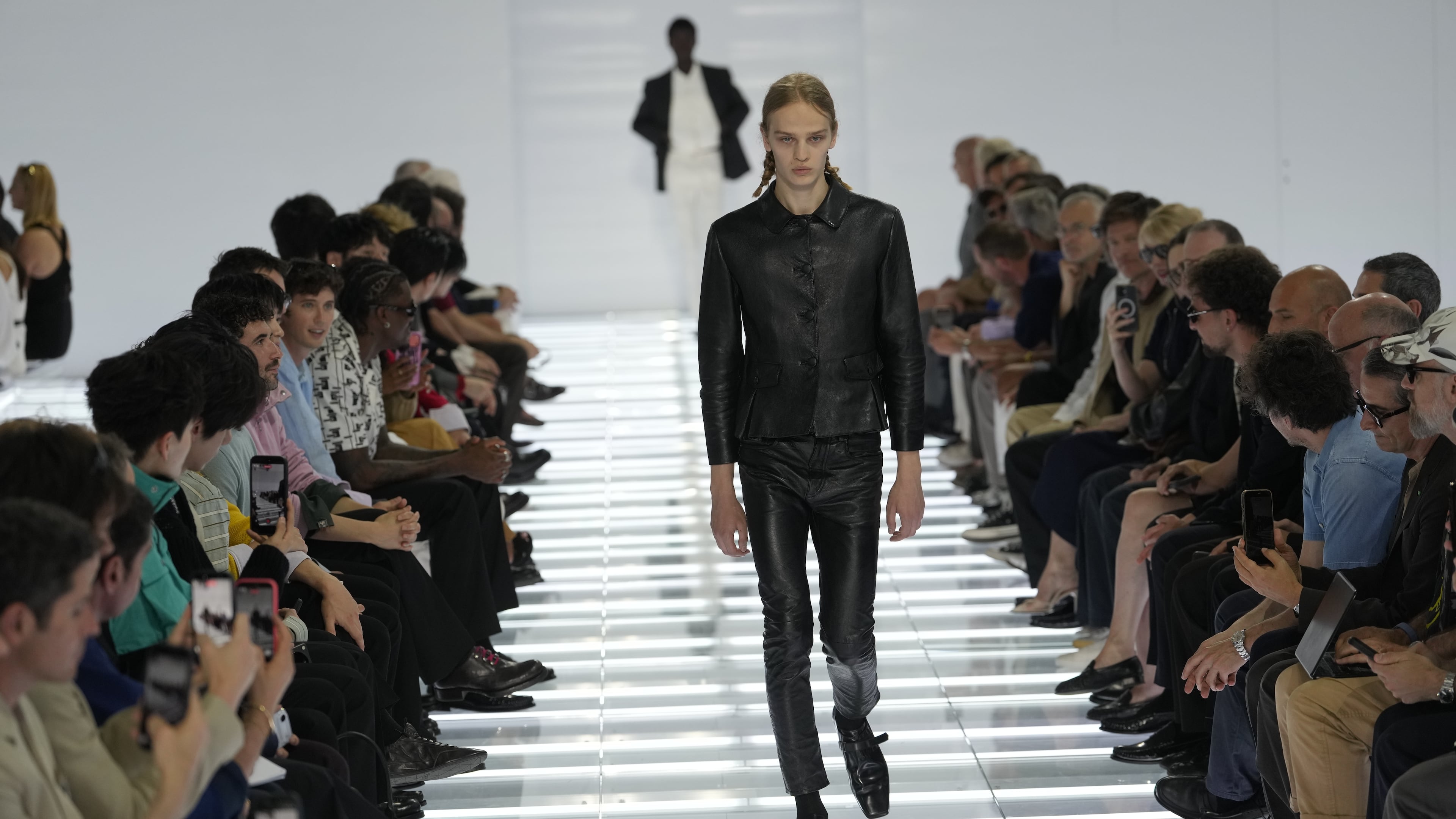 A model wears a creation from Prada's Spring/Summer 2027 men's collection presented in Milan, Italy, Sunday, June 21, 2026. (AP Photo/Luca Bruno)