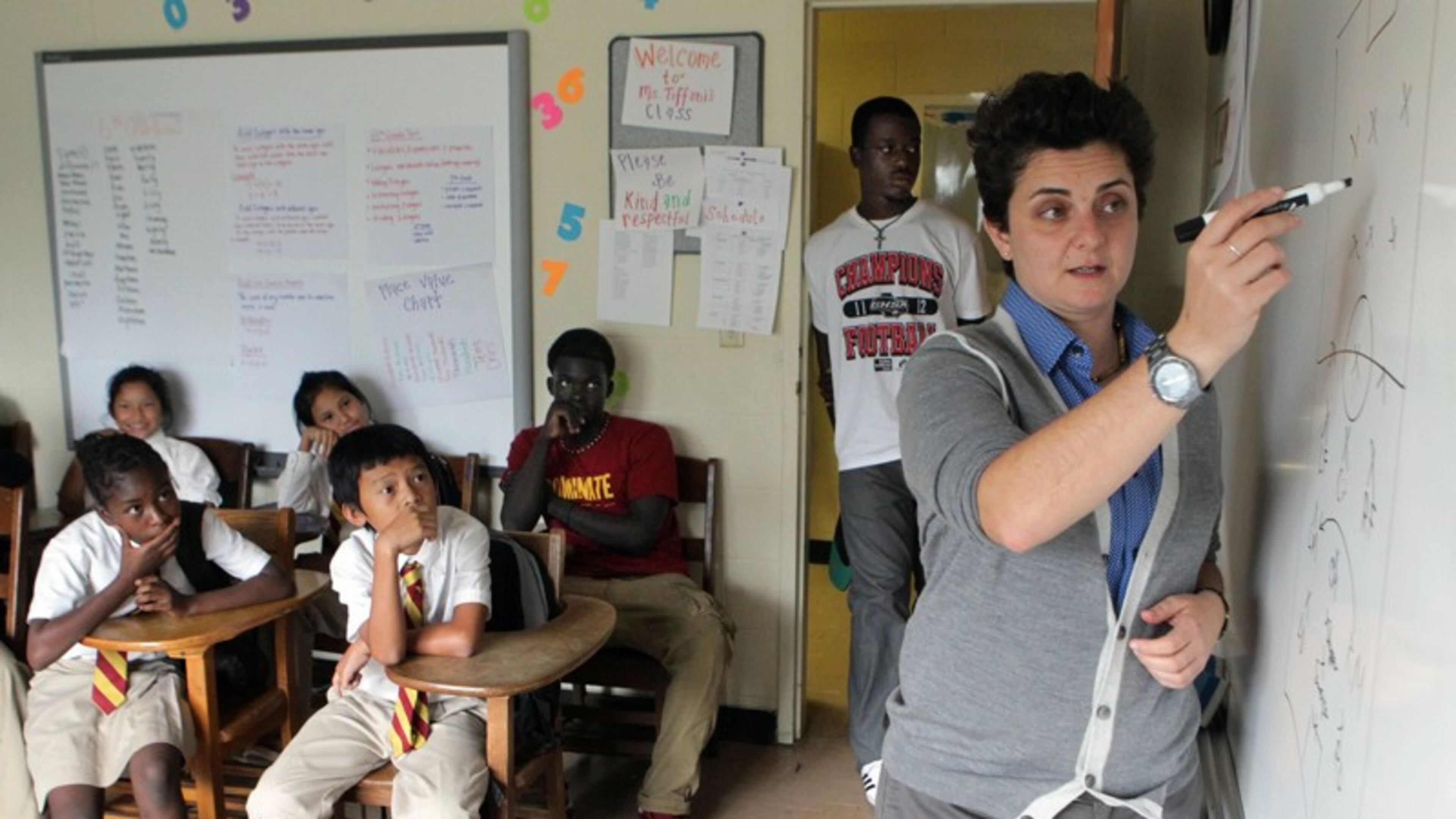 One of the new charter schools approved today is a public school version of the well known Fugees Academy. a private school for refugee children started by Luma Mufleh, shown here teaching at the Clarkson school.