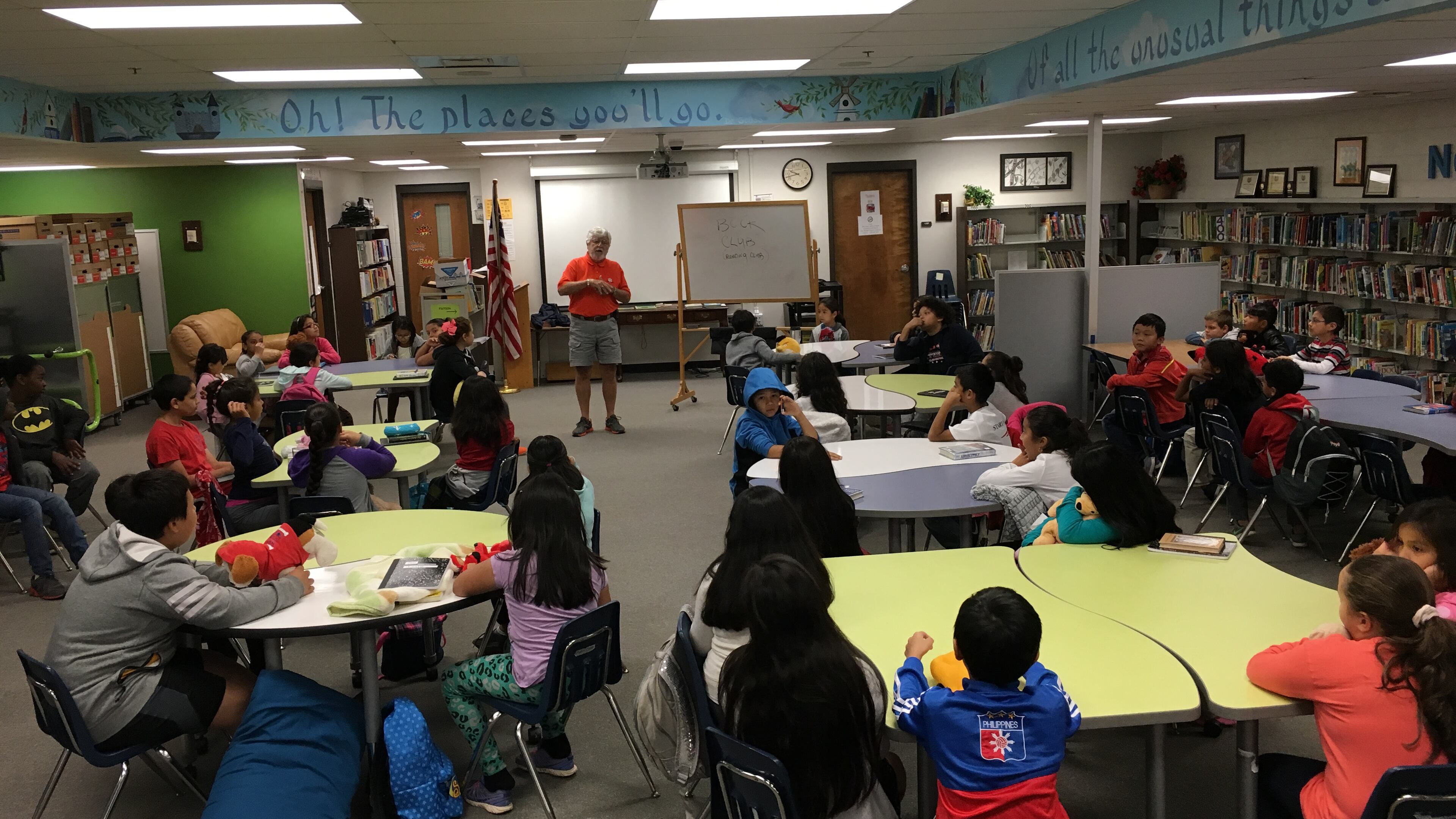 Students from Bethesda Elementary in Lawrenceville pack the school’s media center for a Saturday morning session of “Reading is Fun Again with Finnegan,” a program created and run by volunteer Mickey Finnegan. Credit: Bethesda Elementary.