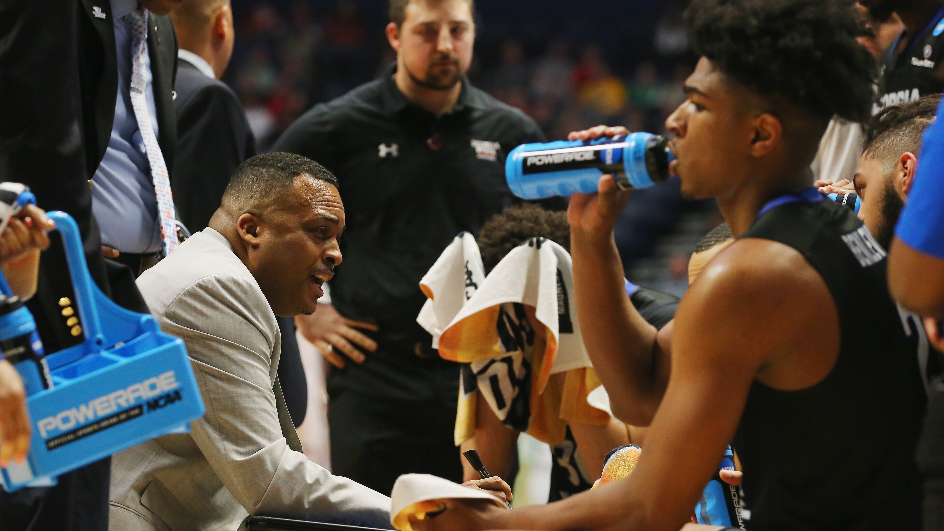 Ron Hunter talks with his team during a timeout om Friday's game. Frederick Breedon/Getty Images)