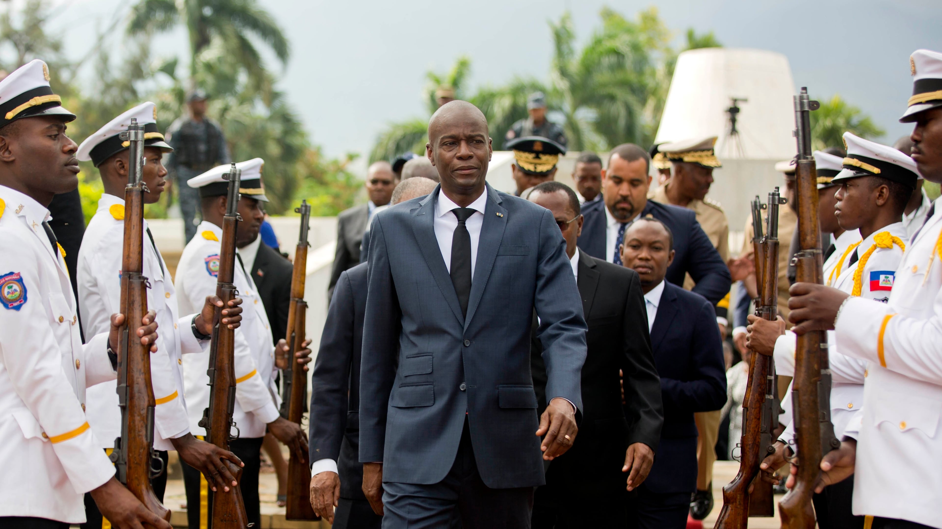 FILE - Haiti's President Jovenel Moise, center, leaves the museum during a ceremony marking the 215th anniversary of revolutionary hero Toussaint Louverture's death, at the National Pantheon museum in Port-au-Prince, Haiti, April 7, 2018. (AP Photo/Dieu Nalio Chery, File)