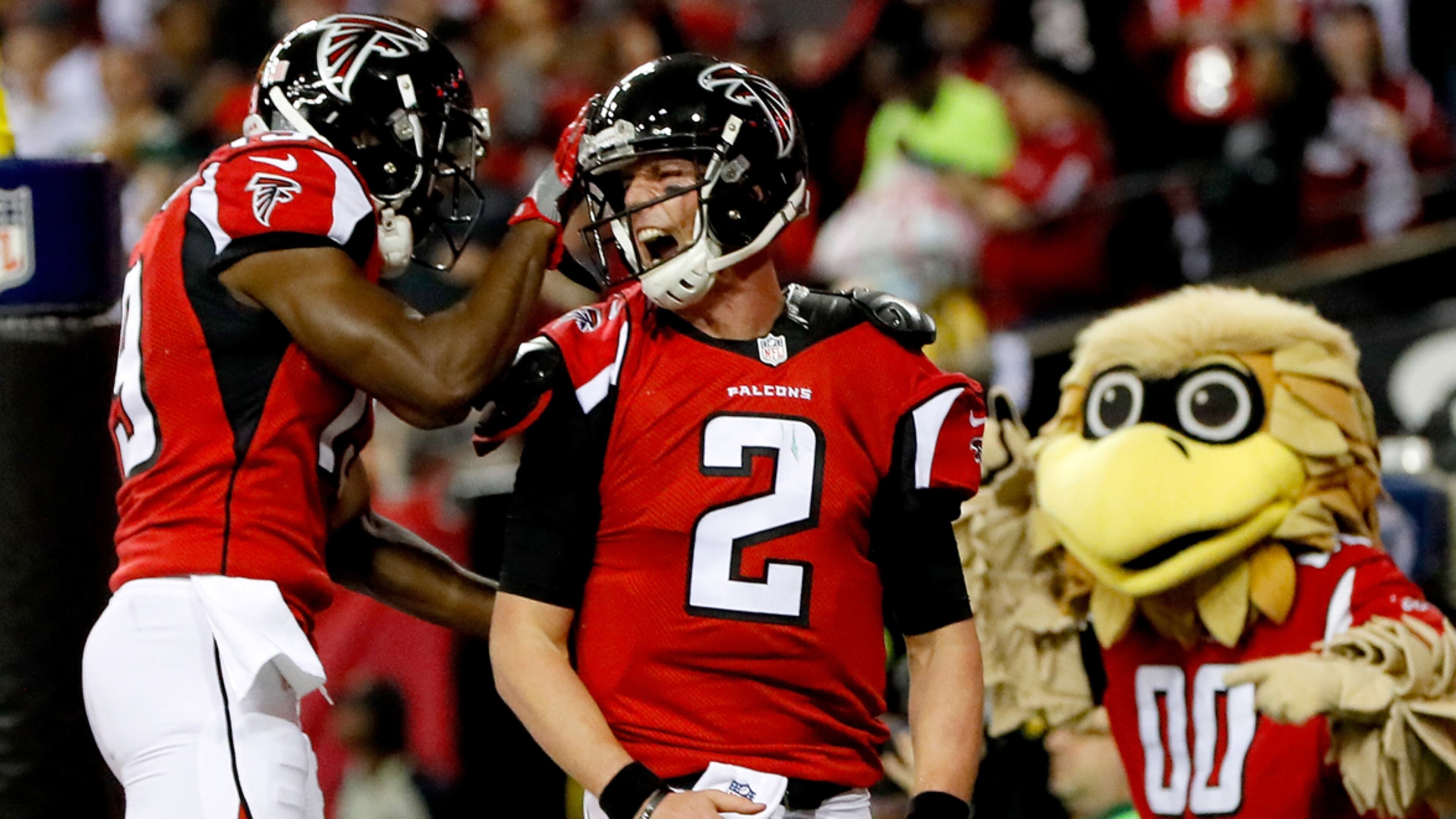 ATLANTA, GA - JANUARY 22: Matt Ryan #2 of the Atlanta Falcons celebrates with Aldrick Robinson #19 after a 14 yard touchdown run in the second quarter against the Green Bay Packers in the NFC Championship Game at the Georgia Dome on January 22, 2017 in Atlanta, Georgia. (Photo by Kevin C. Cox/Getty Images)
