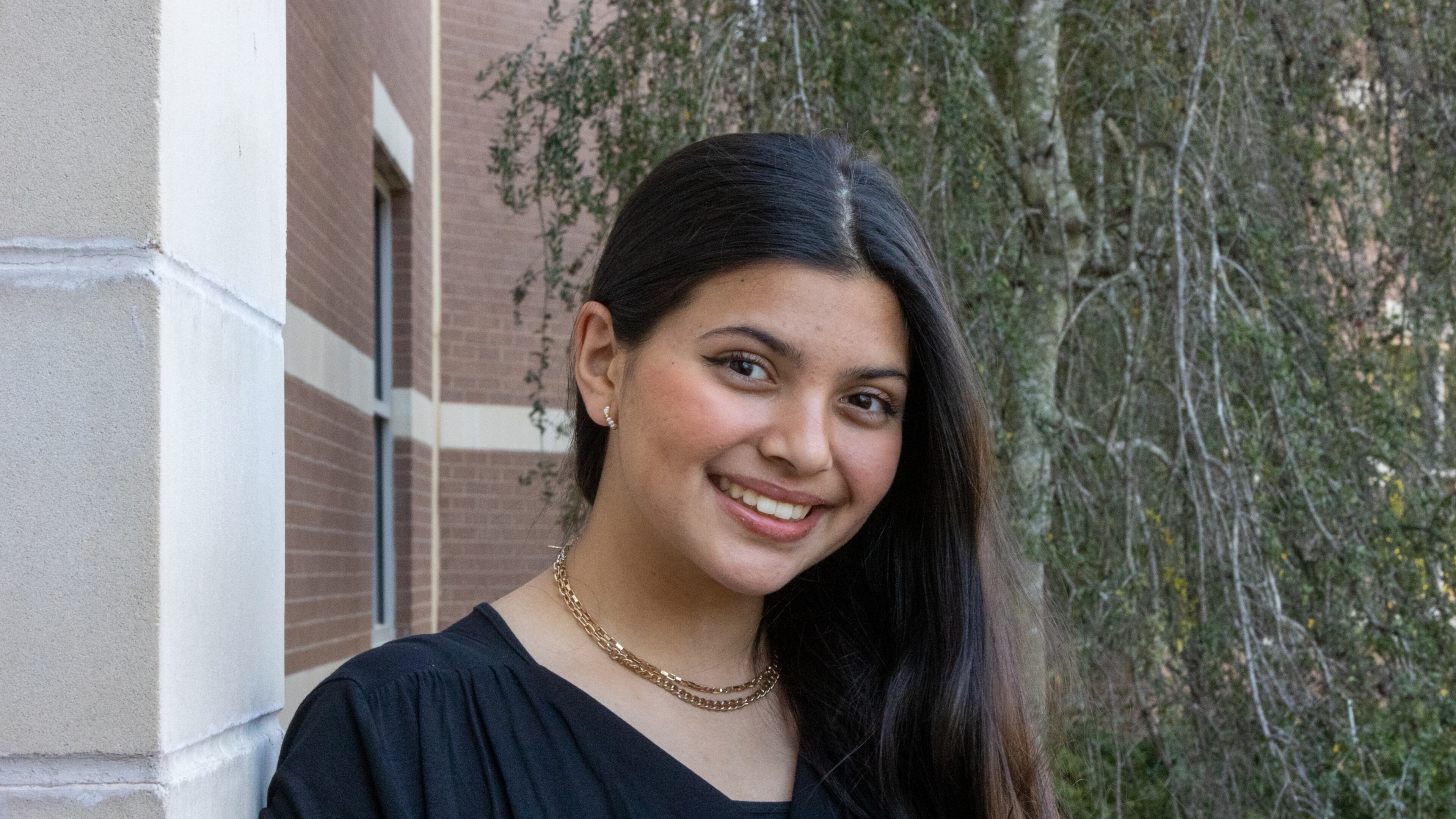 Noor Ali, a freshman at the Gwinnett School of Mathematics, Science, and Technology, started a petition to make the Muslim holiday Eid al-Fitr a day off on the Gwinnett County Public Schools calendar. She's shown outside her school Friday, April 1, 2022. (Jenni Girtman for The Atlanta Journal-Constitution)