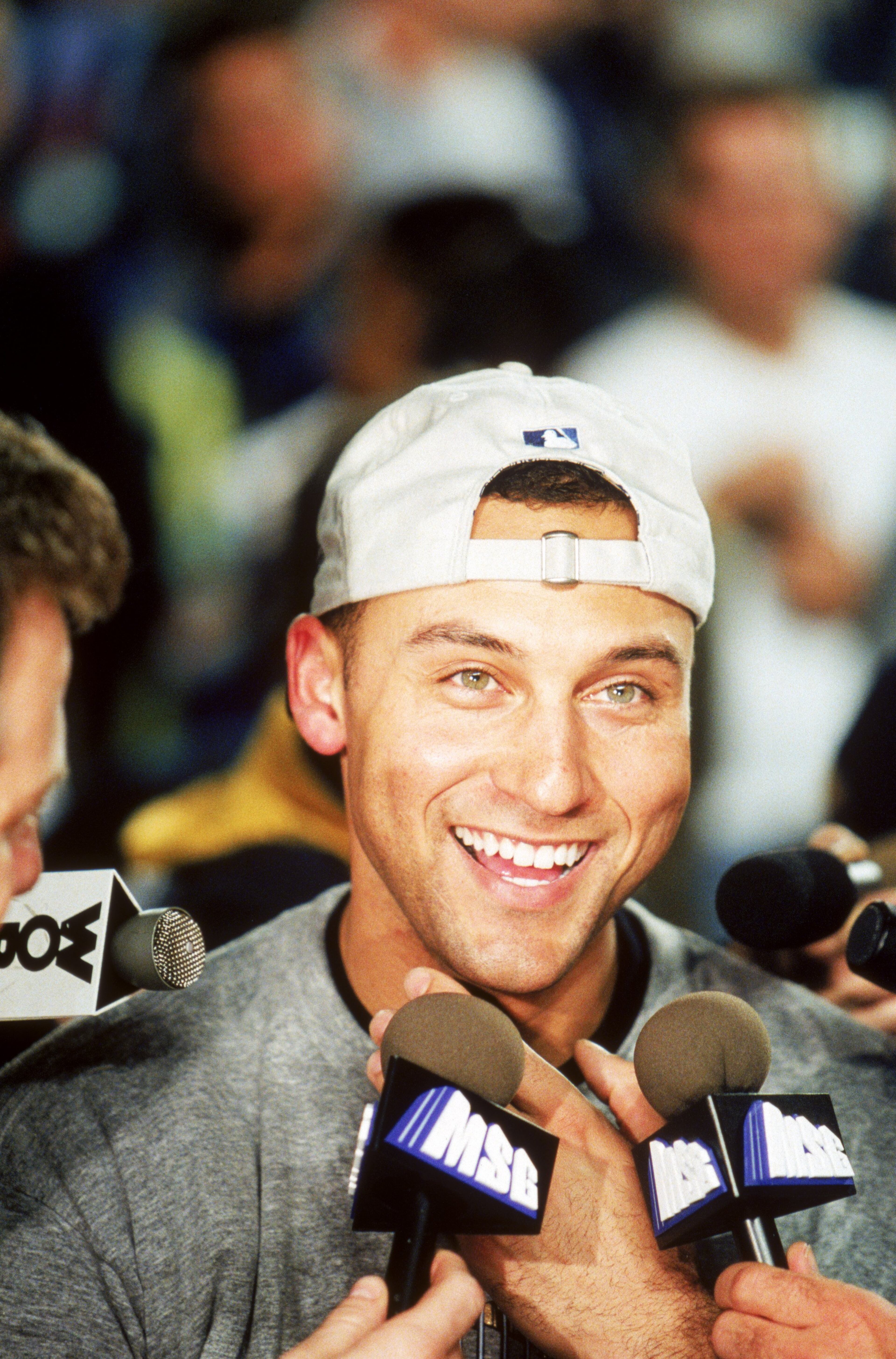 FLUSHING, NY - OCTOBER 26: Derek Jeter #2 of the New York Yankees talks to the media as the Yankees take Game Five to win the 2000 World Series against the New York Mets at Shea Stadium on October 26, 2000 in Flushing, New York. The Yankees won the game 4-2 and the World Series 4 games to 1. (Photo by Rich Pilling/MLB Photos via Getty Images)
