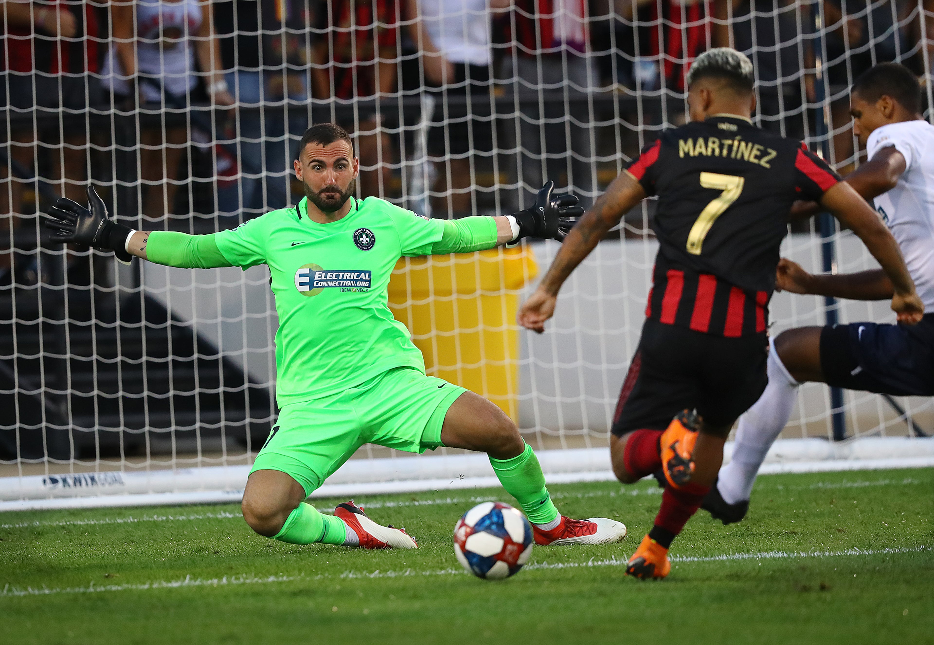 St. Louis goalkeeper Tomas Gomez blocks a shot by Atlanta United midfielder Josef Martinez. Curtis Compton/ccompton@ajc.com