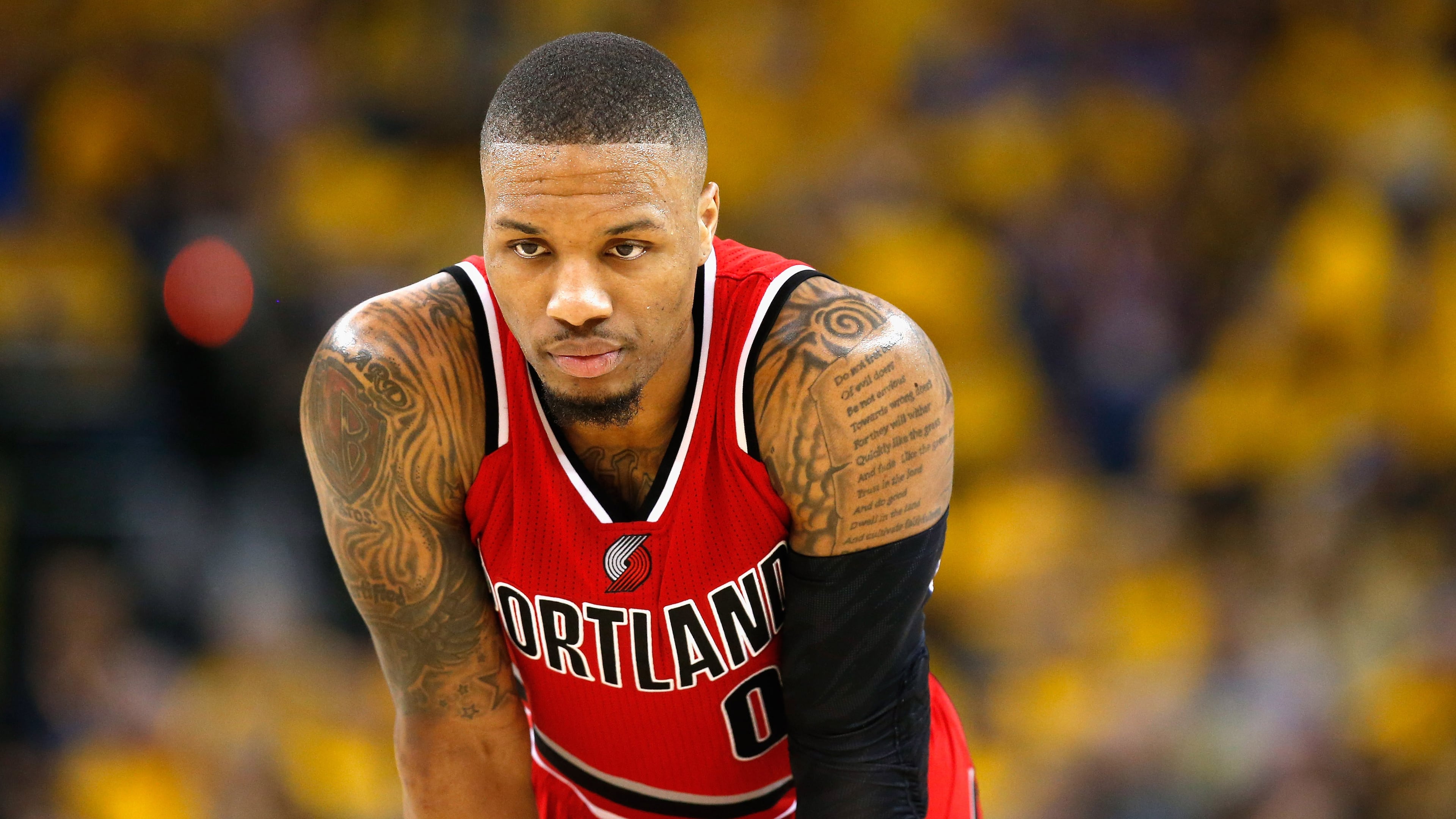 Portland's Damian Lillard has 22 lines of the Psalm 37 tattooed on his left arm.