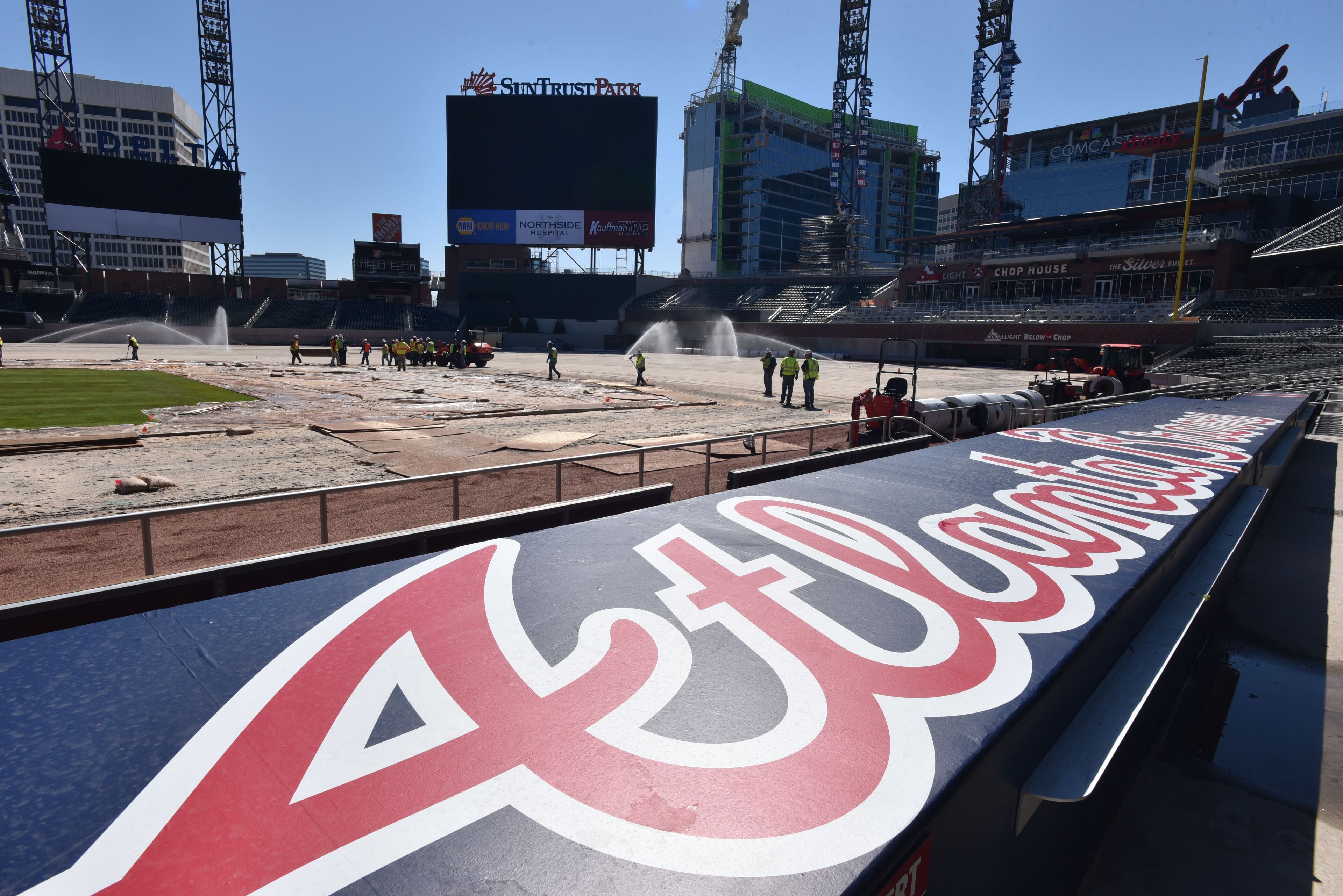 March 4, 2017 Atlanta - Workers install sod in the infield at SunTrust Park on Saturday, March 4, 2017. The Braves marked an important milestone in the construction of SunTrust Park on Saturday. Workers began the installation of 109,000 square feet of sod on the field, a task that will continue Sunday. The Braves selected a type of grass called âSeashore Paspalum, Platinum TEâ for the stadium, according to field director Ed Mangan. HYOSUB SHIN / HSHIN@AJC.COM