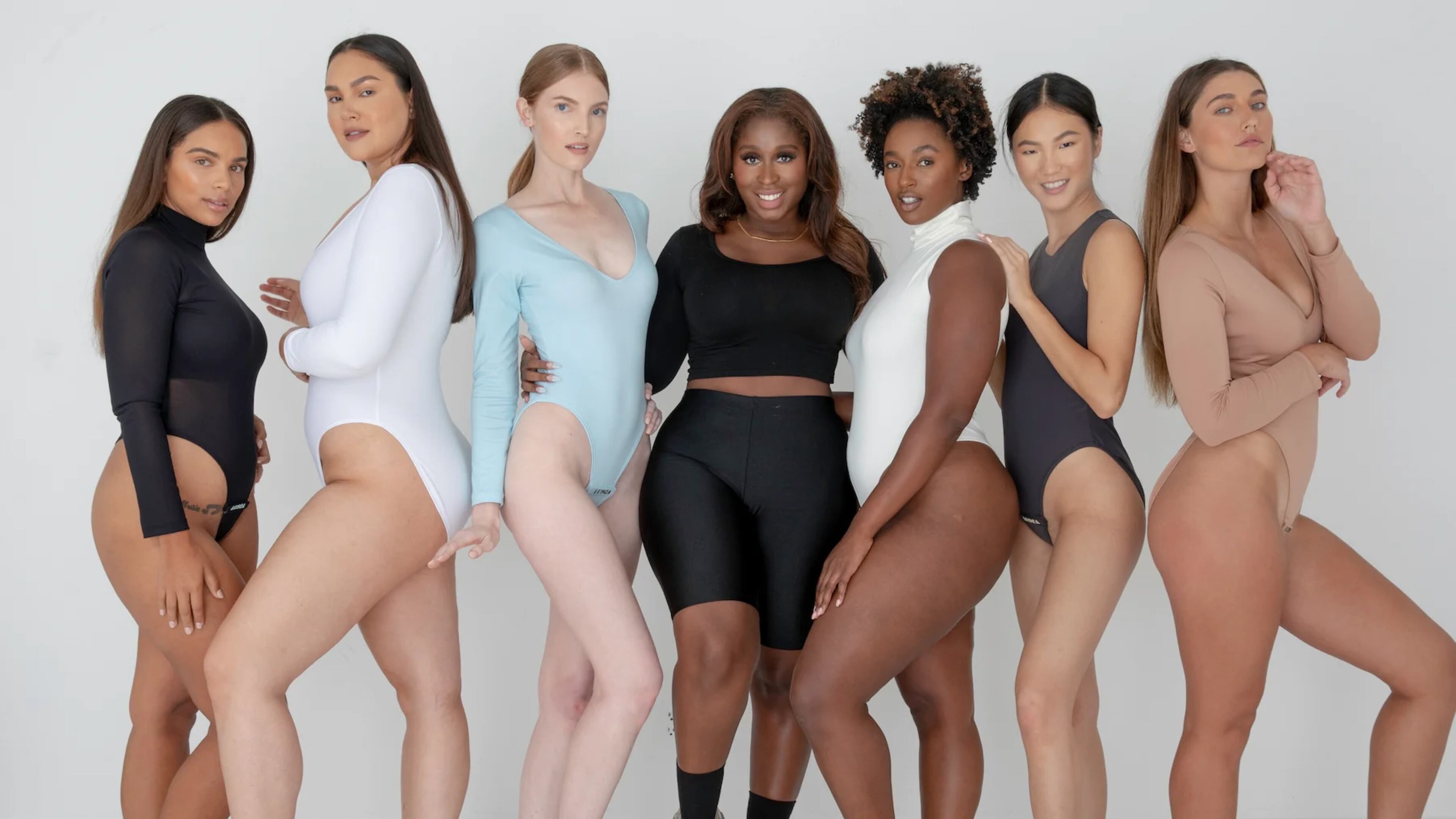 LUSCA founder Toby Morgan (center) poses with models wearing her company's innovative bodysuits. (Courtesy of LUSCA)