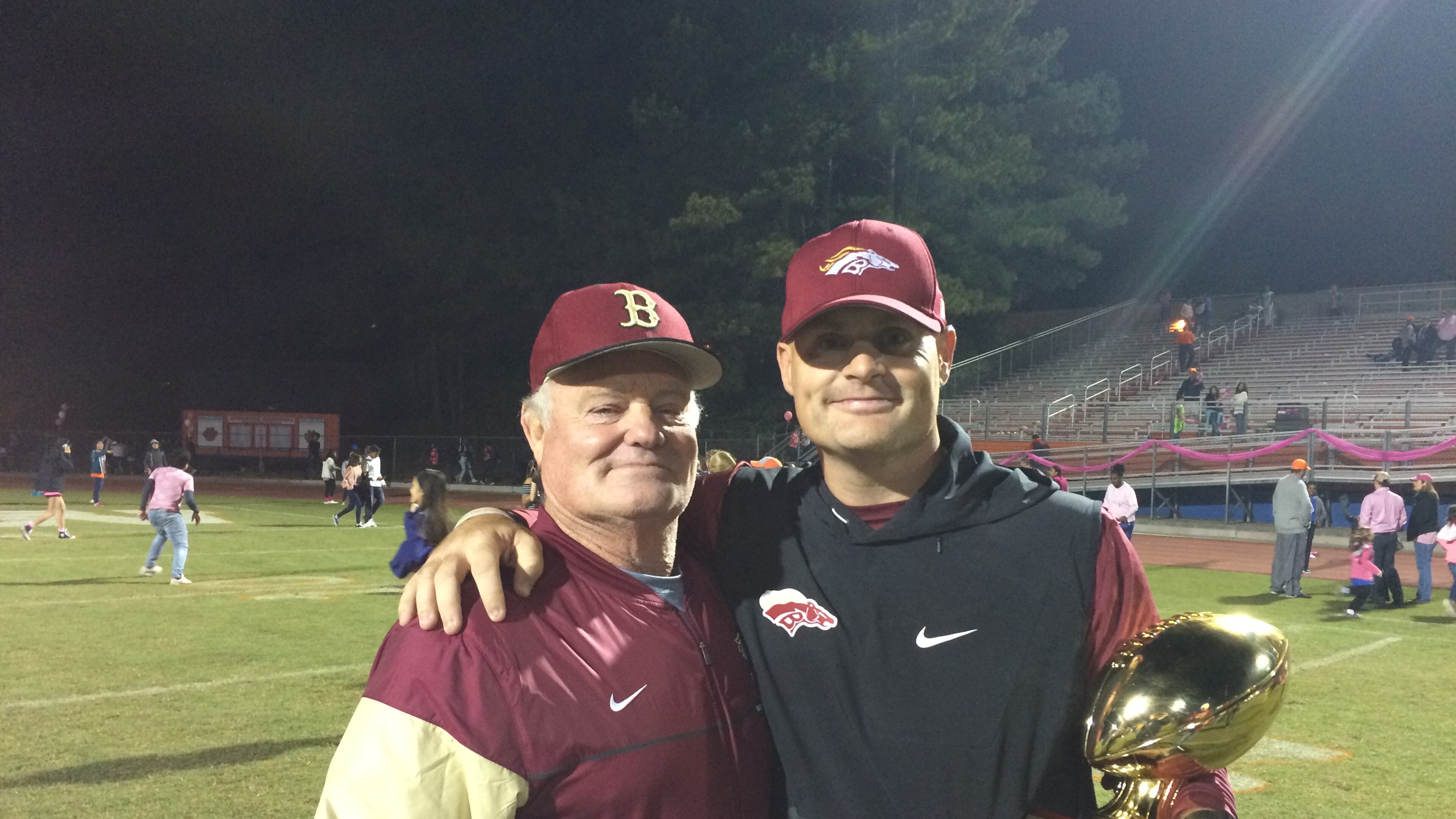 Brookwood coach Philip Jones (right) celebrates the win over Parkview with his father, former Brookwood assistant Tom Jones.