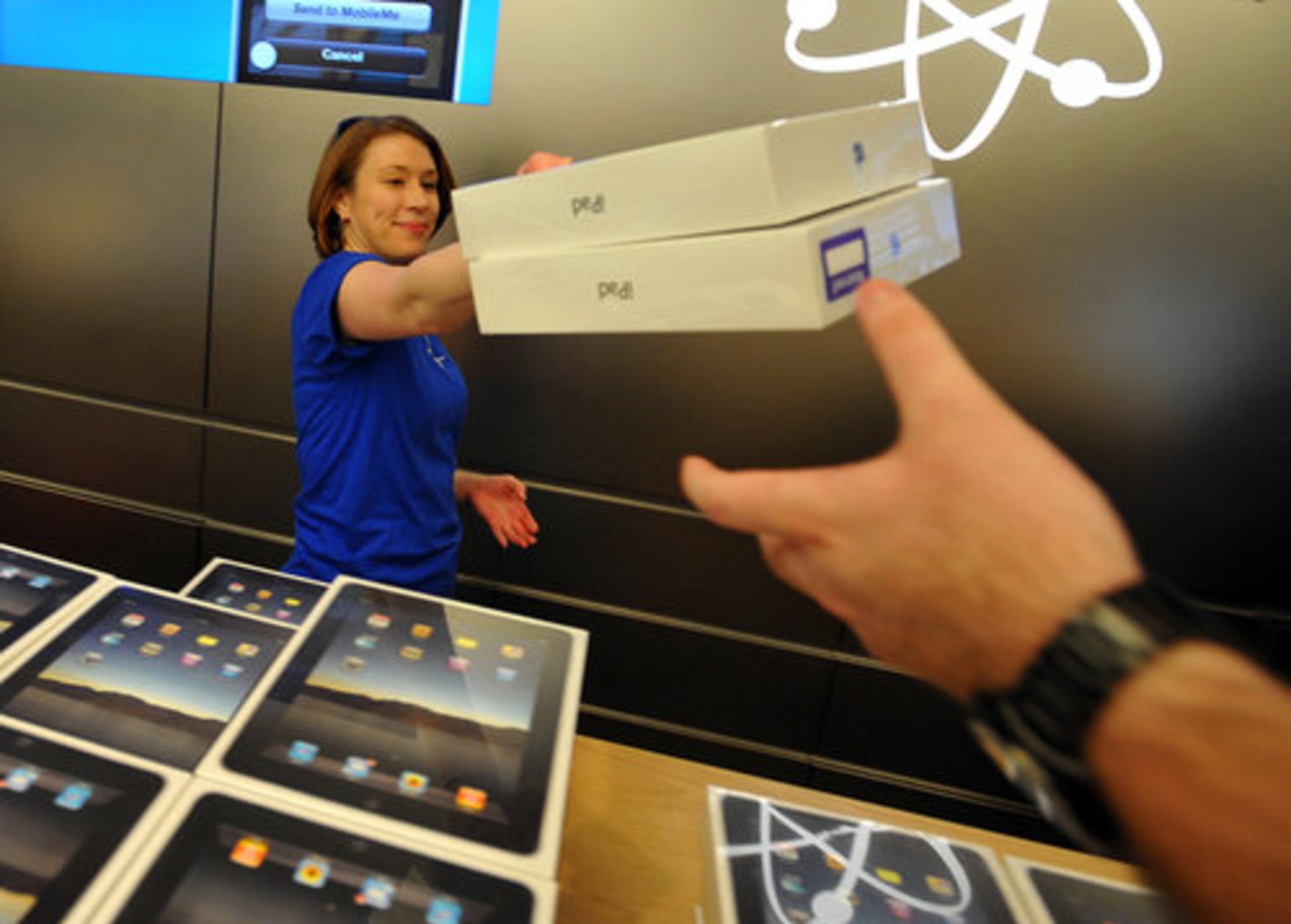 Apple store employee Sarah Brown had plenty of iPads ready to hand out.