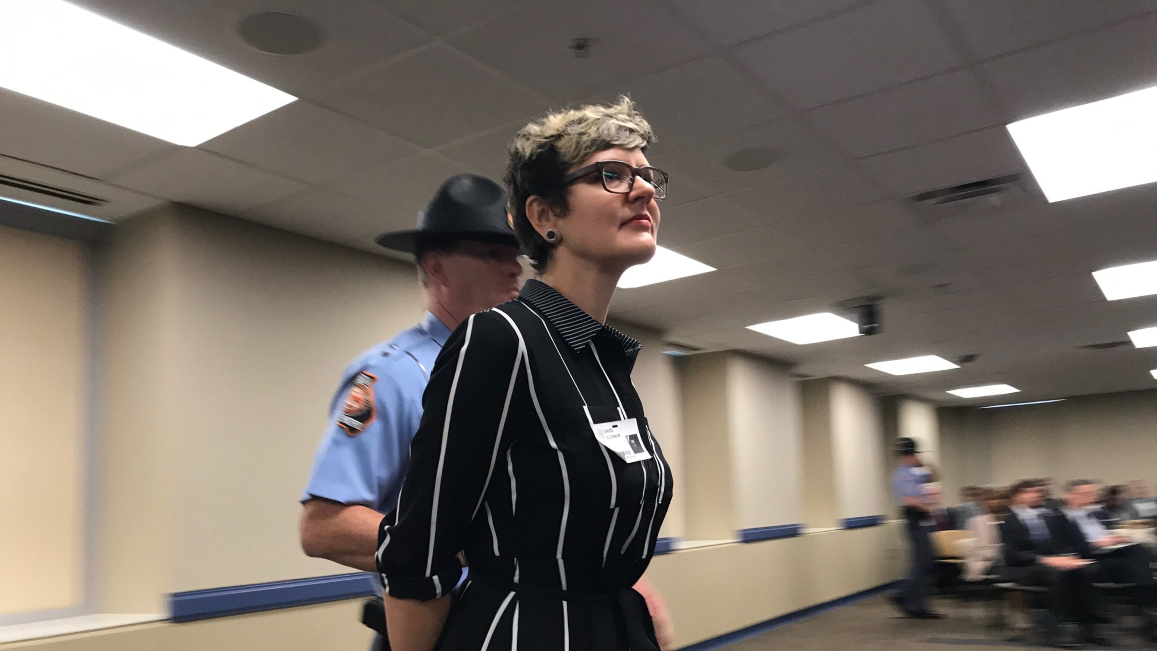 Demonstrator Eleanor Davis is removed from the May 16, 2017 Georgia Board of Regents meeting for protesting the University System of Georgia's admissions policy toward those without legal status. ERIC STIRGUS/ESTIRGUS@AJC.COM