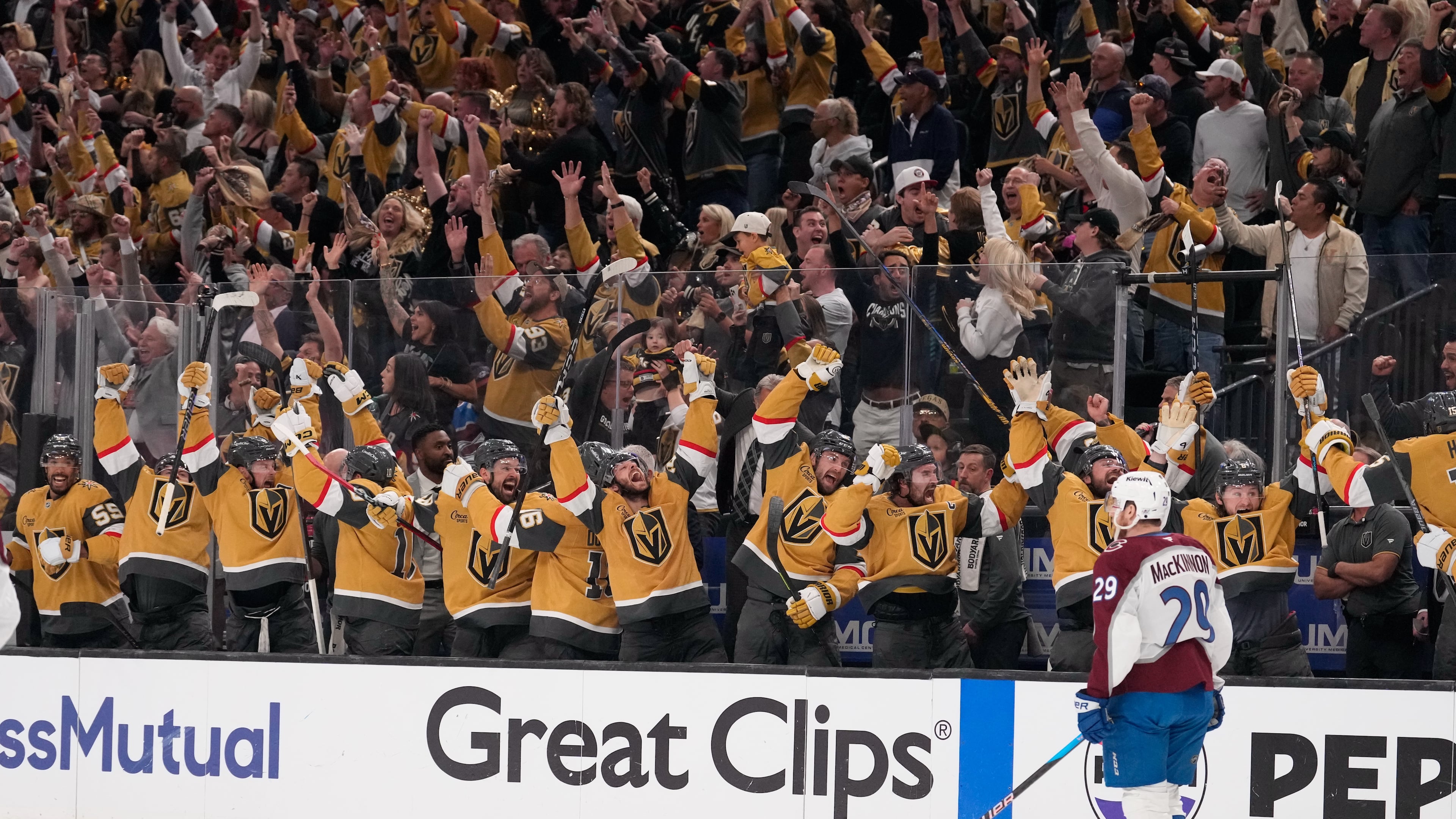 Members of the against the Vegas Golden Knights celebrate an empty net goal by Brett Howden as Colorado Avalanche center Nathan MacKinnon skates by during the third period in Game 3 of the Western Conference finals NHL hockey Stanley Cup playoff series Sunday, May 24, 2026, in Las Vegas. (AP Photo/Mark J. Terrill)