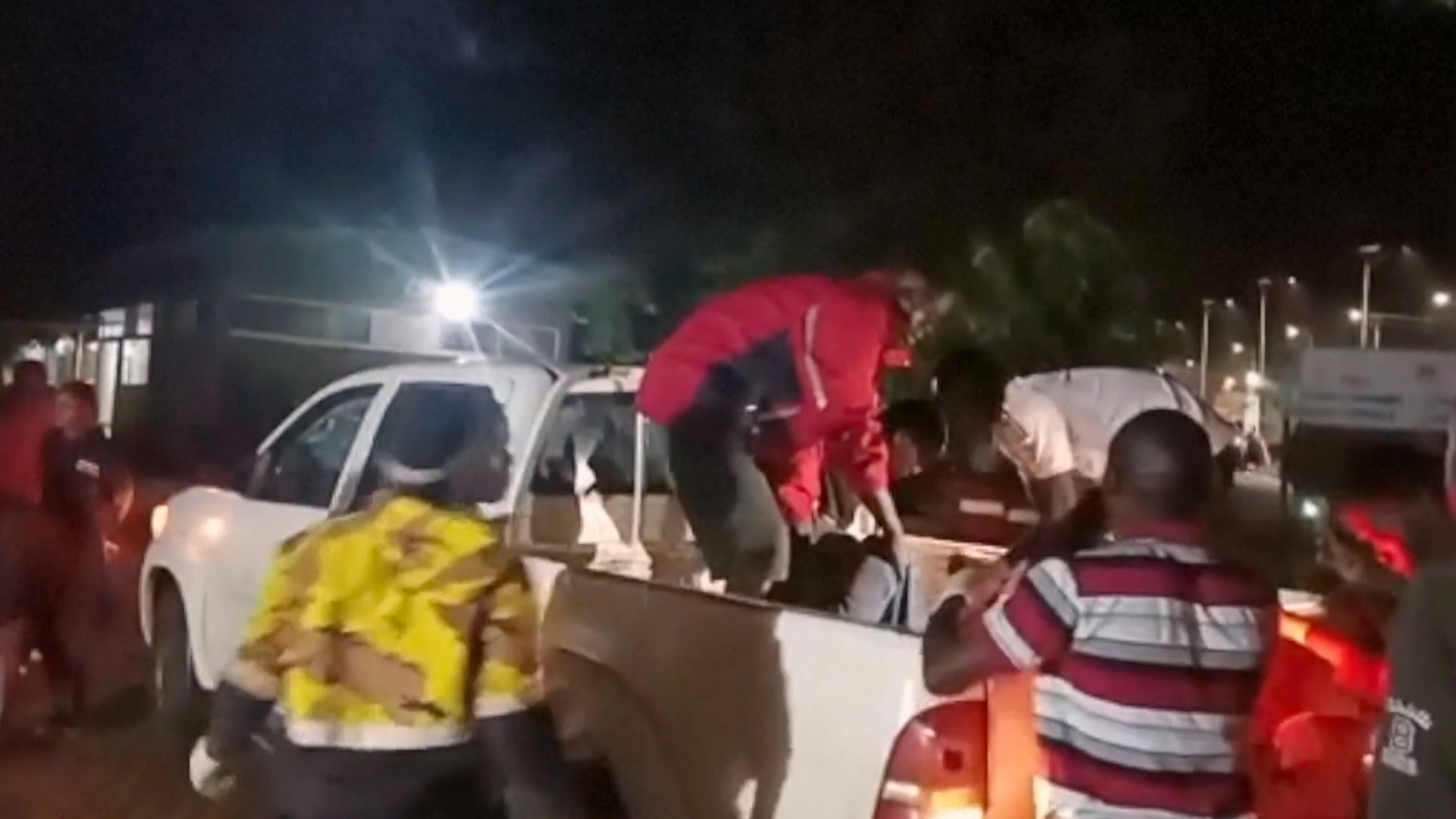 This grab from video provided by Ugandan Red Cross shows injured children being brought in a pickup vehicle to a hospital after an elementary bus crashed Thursday night in the Kapchorwa District in eastern Uganda, Thursday, July 16, 2026. (Ugandan Red Cross via AP)