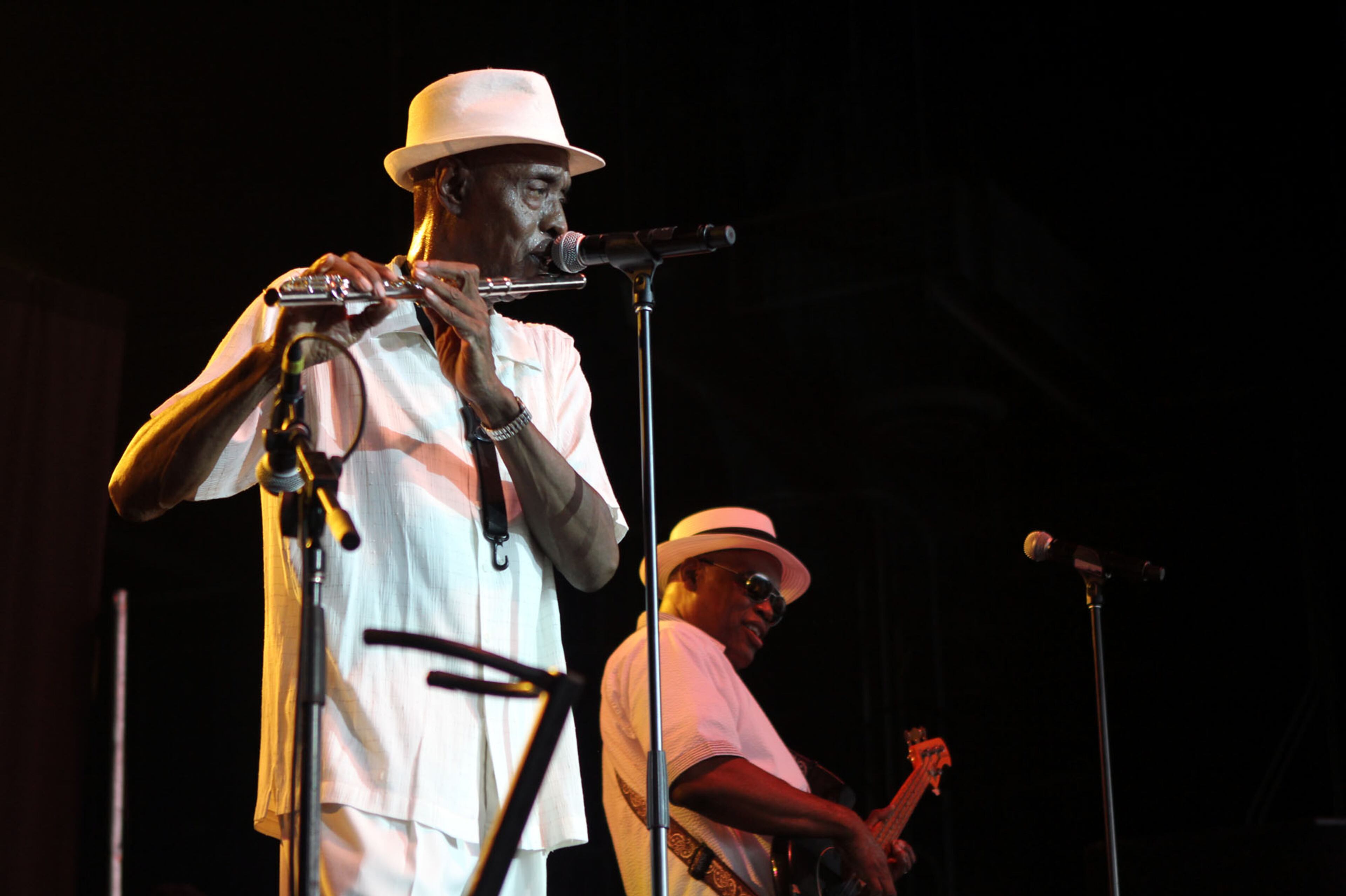 Jimmy Brown riffs on his flute as Regi Hargis Hickman lays down the bass while performing Brick's classic hit, "Dazz," at the 2013 Flashback Festival at Aaron's Amphitheatre at Lakewood in Atlanta on Saturday.