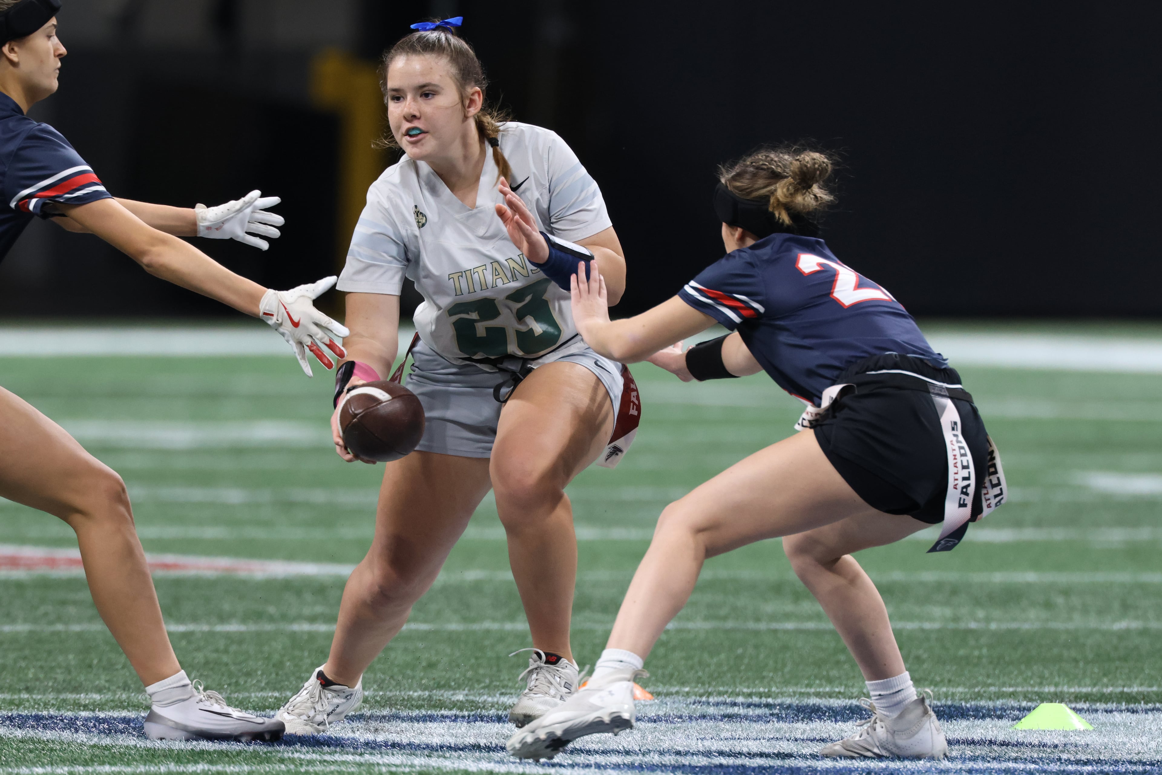 Blessed Trinity’s Adalyn Kramer looks for a path during the flag football Division 4 championship match between Milton and Blessed Trinity in Atlanta, Georgia on Tuesday, December 16, 2025. (Addison Simmons for the AJC)