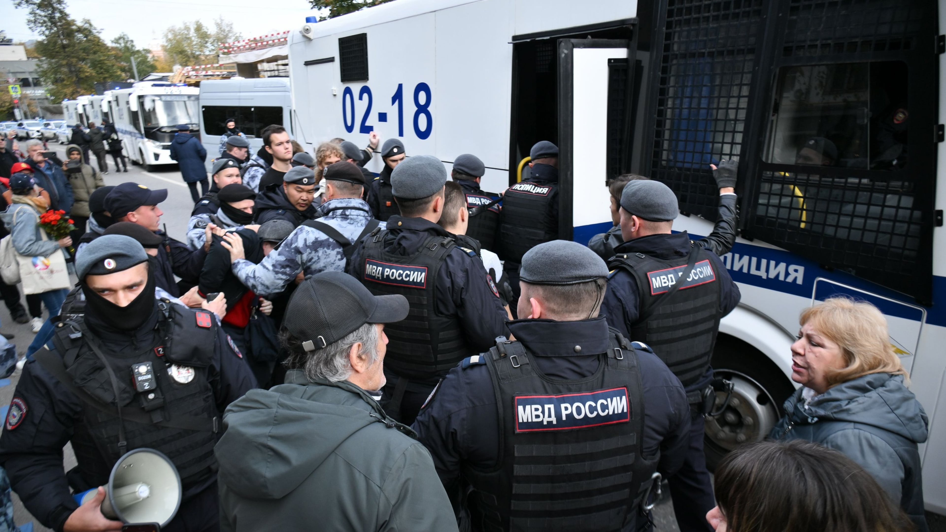 In this photo released by Russian Communist Party Press Service, Police detain demonstrators after a rally marking the 33rd anniversary of the events in memory of those who were killed during the 1993 bloody clashes between government forces and supporters of the rebellious parliament, in Moscow, on Sunday, Oct. 4, 2026. (Russian Communist Party Press Service via AP)