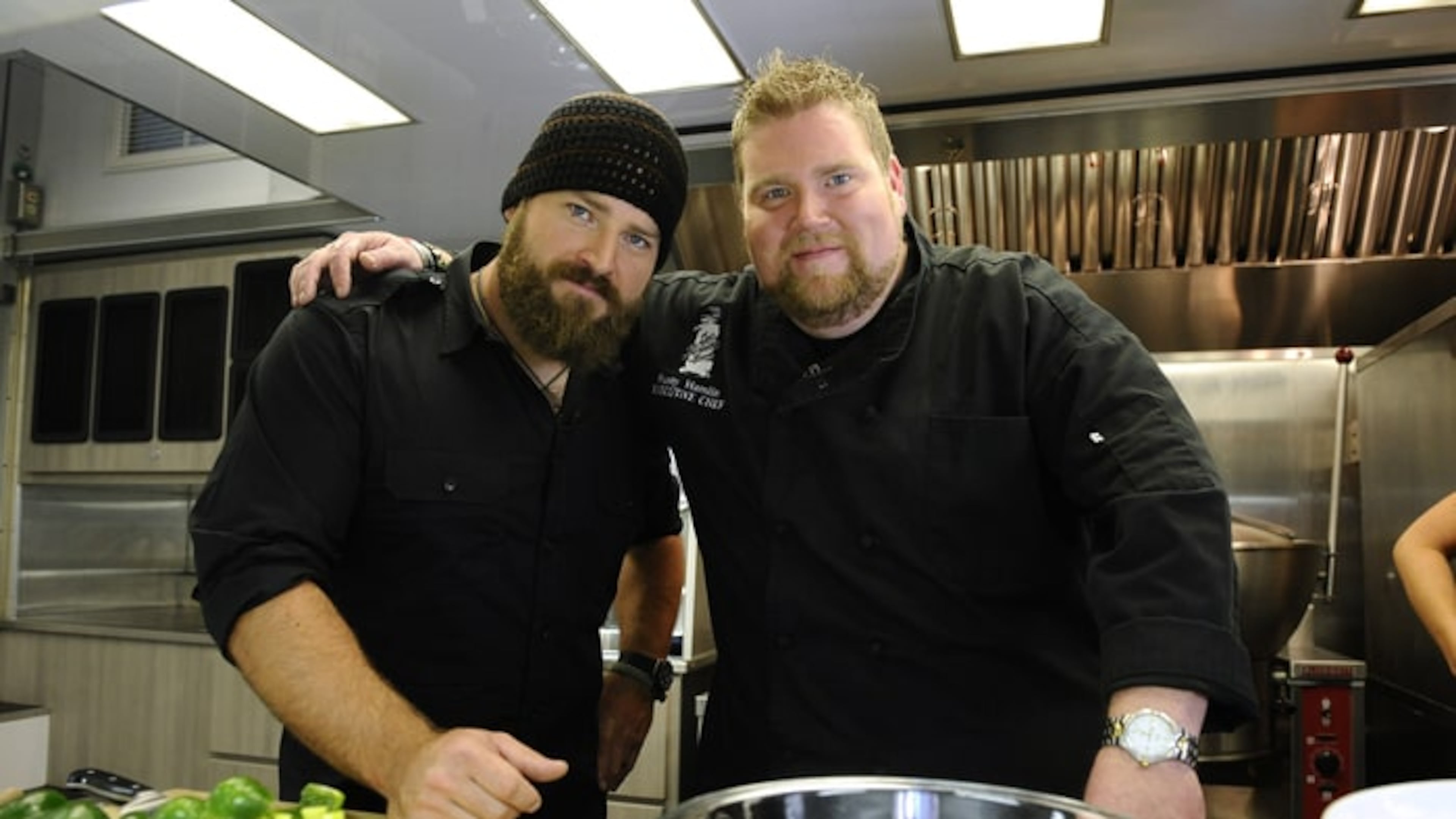 Zac Brown and Rusty Hamlin share a love of cooking, highlighted on 'Rusty's RockFeast' on FYI in 2015. Credit: Peter Kramer/NBC/NBCU