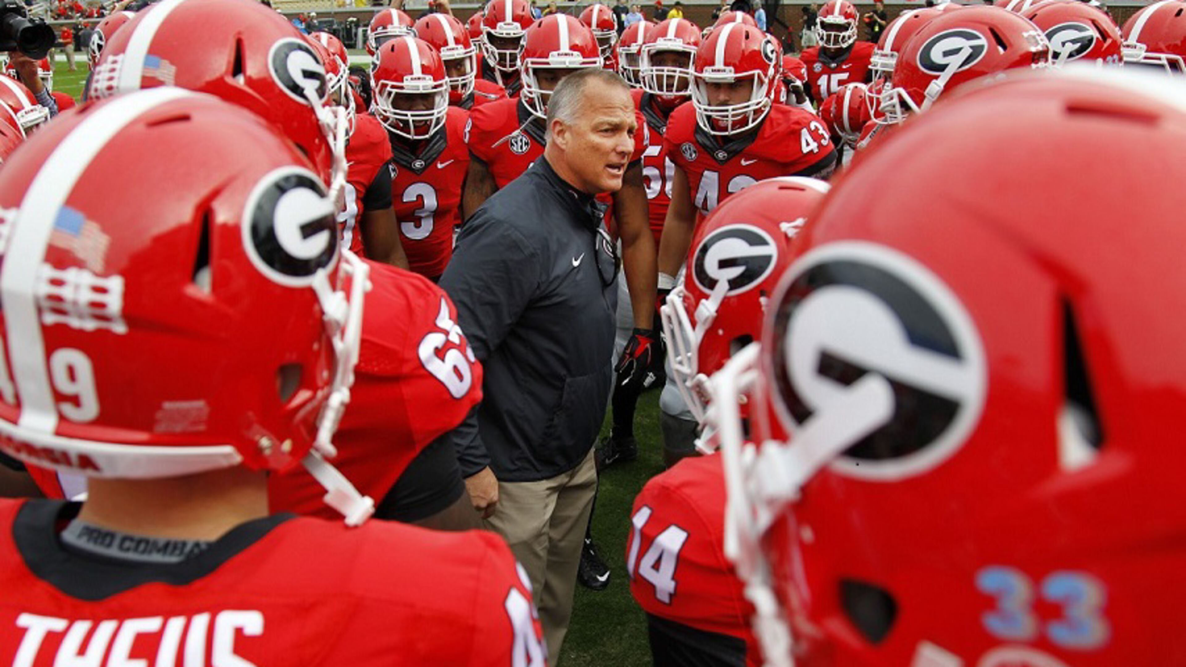 Georgia coach Mark Richt talks to his team before a game against Georgia Tech on Saturday, Nov. 28, 2015, in Atlanta.(AP Photo/Brett Davis)