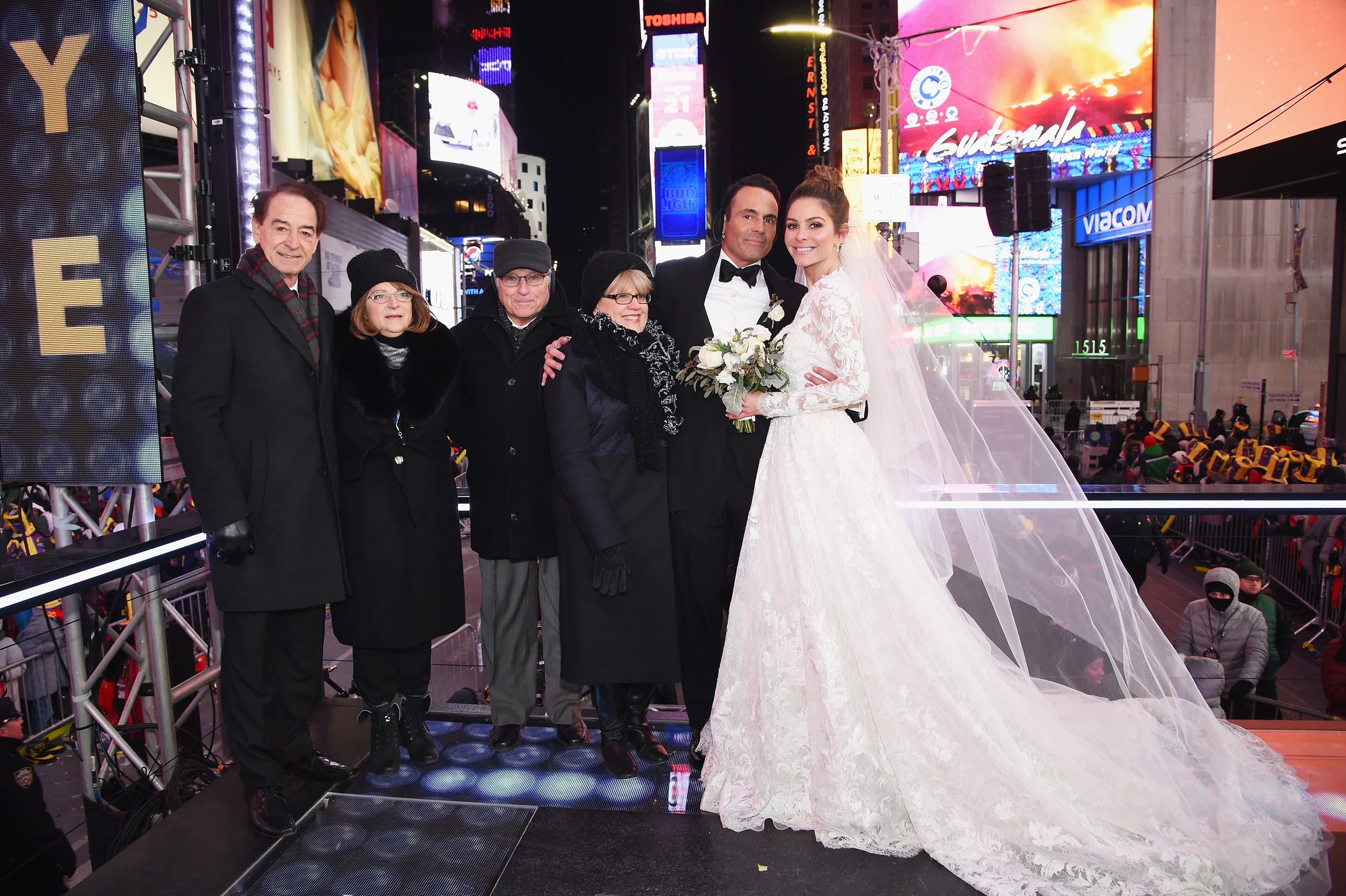 NEW YORK, NY - DECEMBER 31: Keven Undergaro (L) and Maria Menounos hold their wedding ceremony with family members during Maria Menounos and Steve Harvey Live from Times Square at Marriott Marquis Times Square on December 31, 2017 in New York City. (Photo by Dimitrios Kambouris/Getty Images for MM)