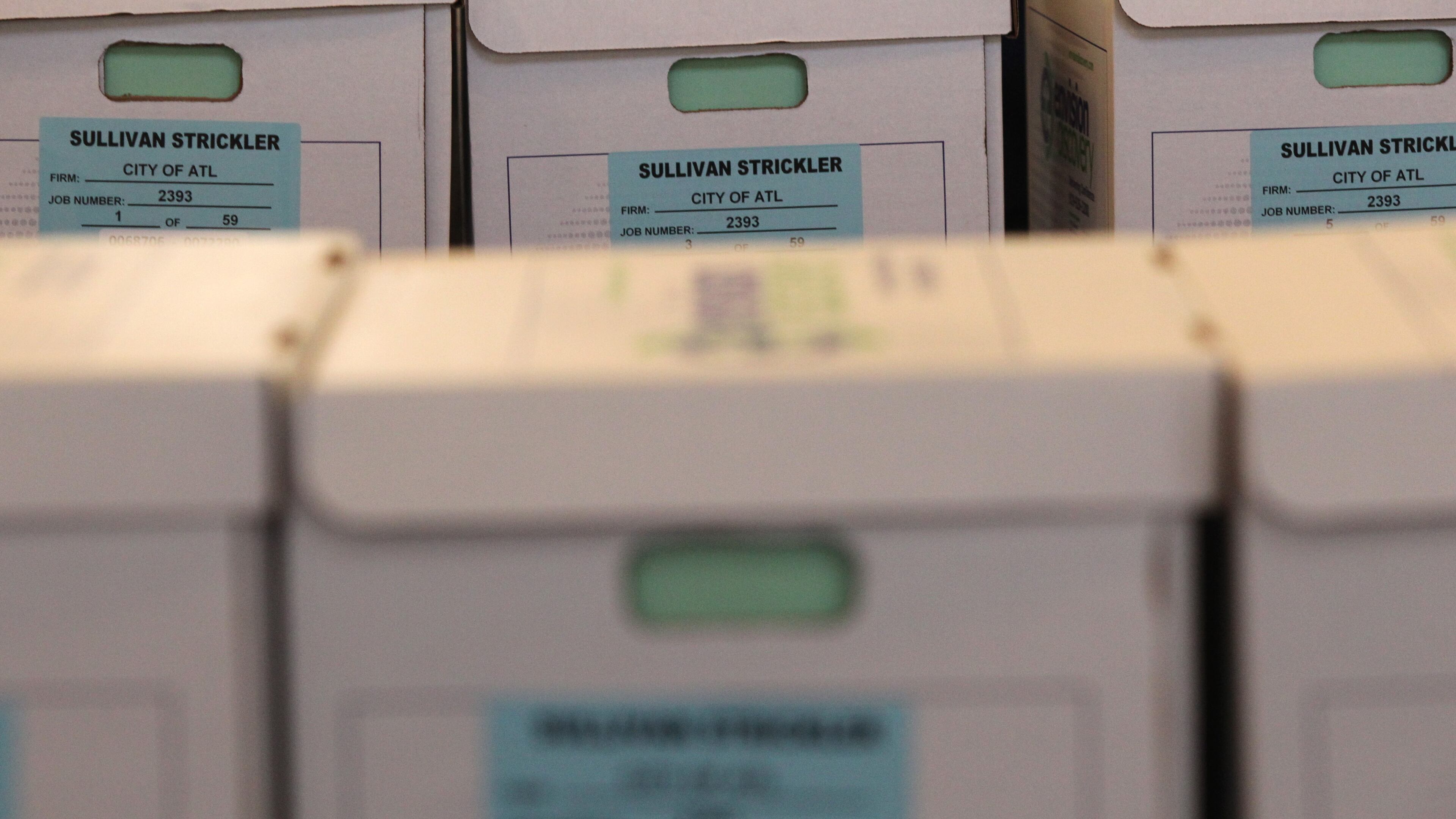 Multiple rows of boxes containing documents related to the Atlanta City Hall bribery investigation were released to the press and public in Atlanta, Georgia, on Thursday, Feb. 9, 2017. HENRY TAYLOR / AJC