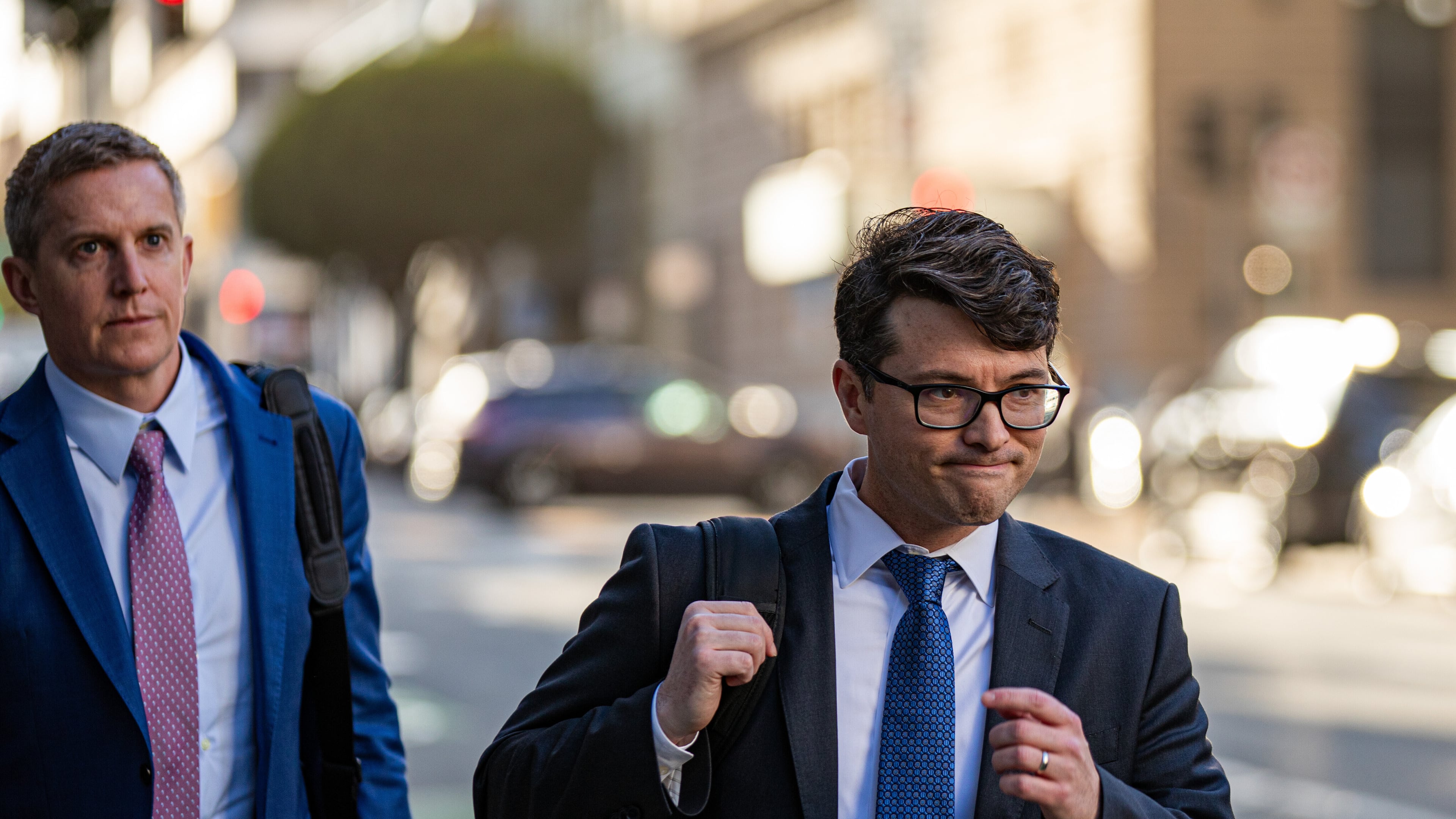 Members of Elon Musk's legal team, including attorney Stephen Broome, left, exit the Phillip Burton Federal Building after representing Elon Musk, in San Francisco, Wednesday, March 4, 2026. (Dan Hernandez/San Francisco Chronicle via AP)