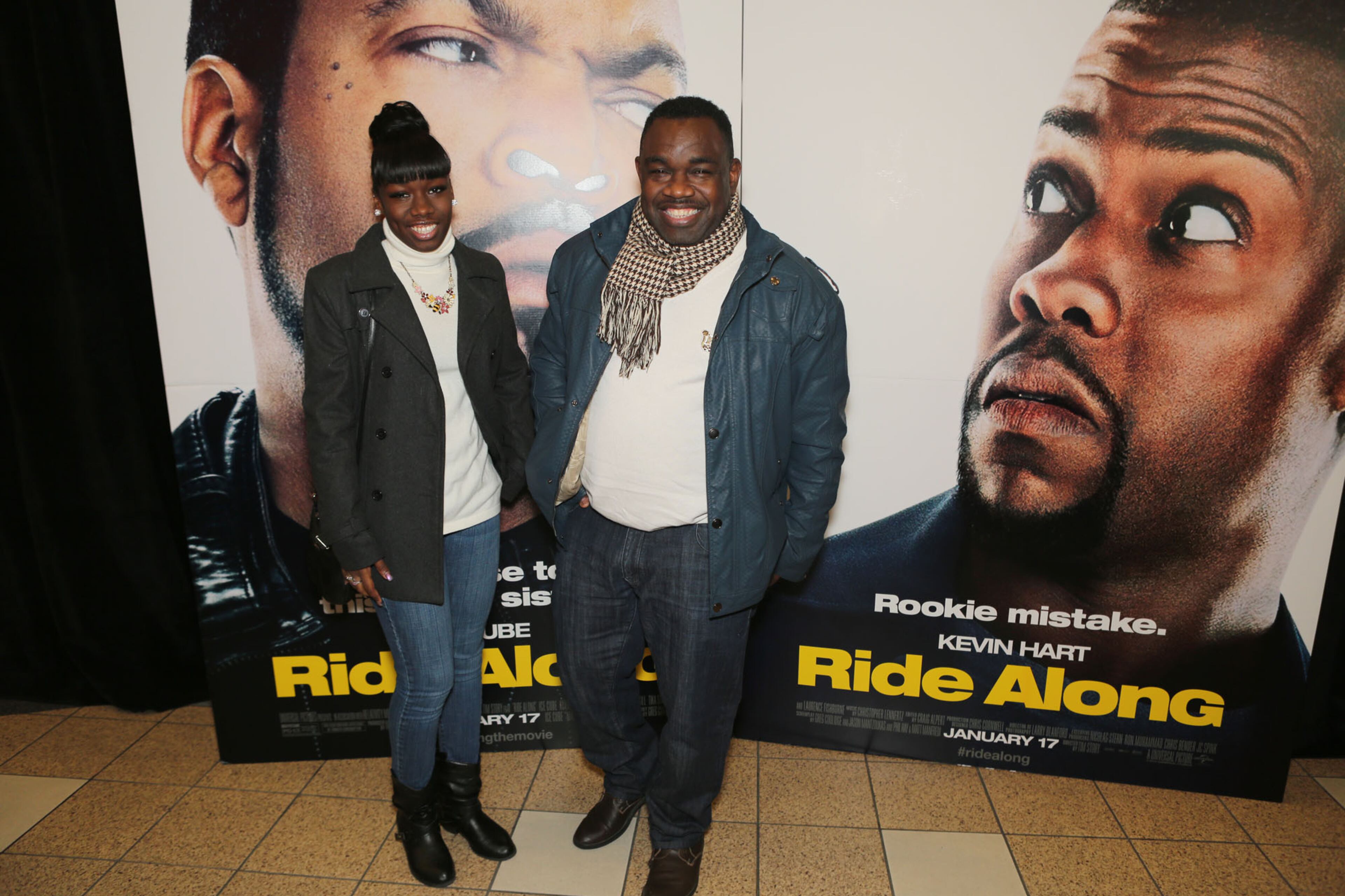 Actor Rodney Perry and his daughter pose on the red carpet for the premier of comedy action film "Ride Along," at the Atlantic Station Regal Theater in Atlanta Monday, Jan. 6, 2014.