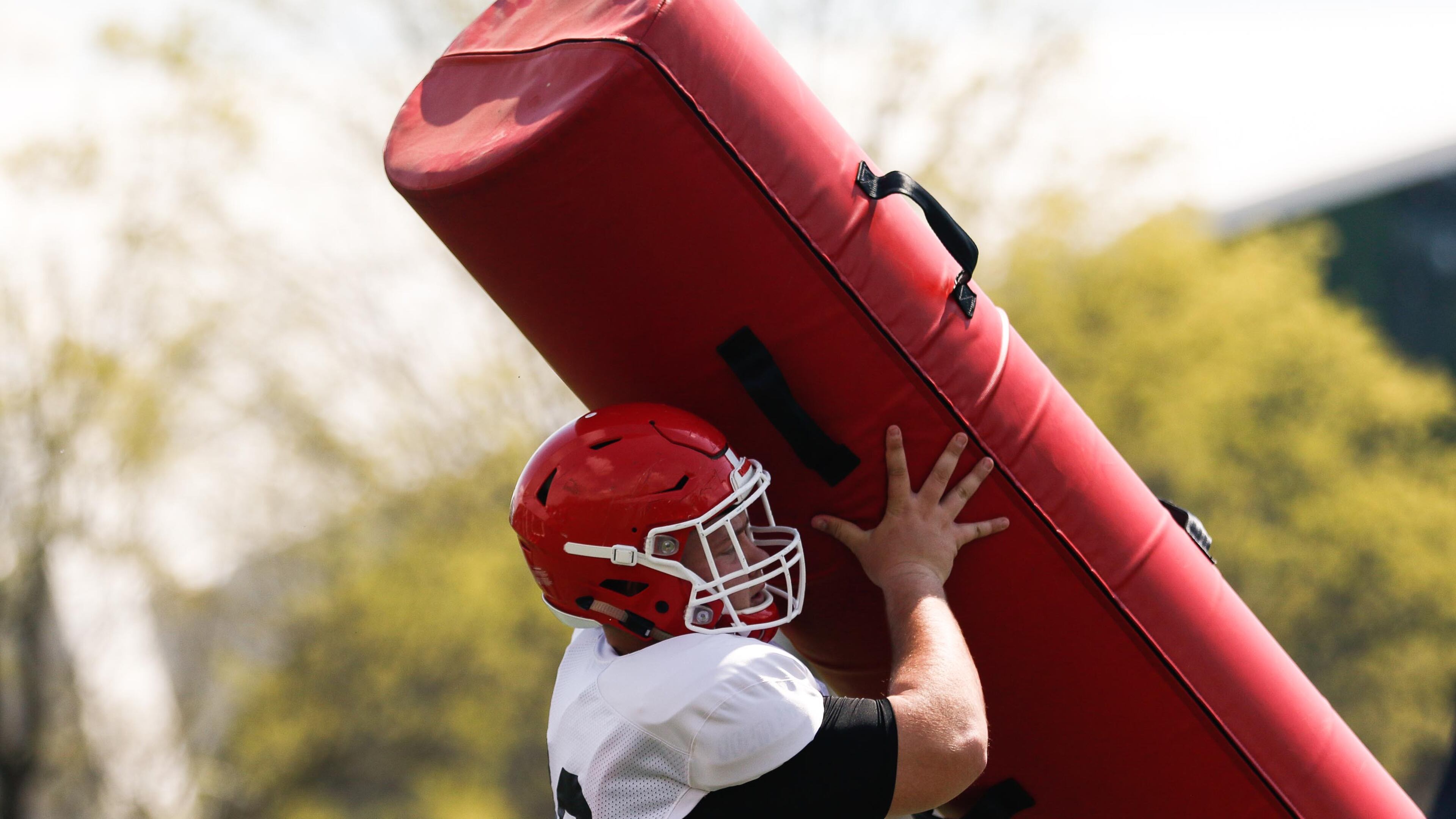 Georgia football players take the field during spring practice Saturday, March 30, 2019, in Athens. Defensive players worked on staying low on tackles.