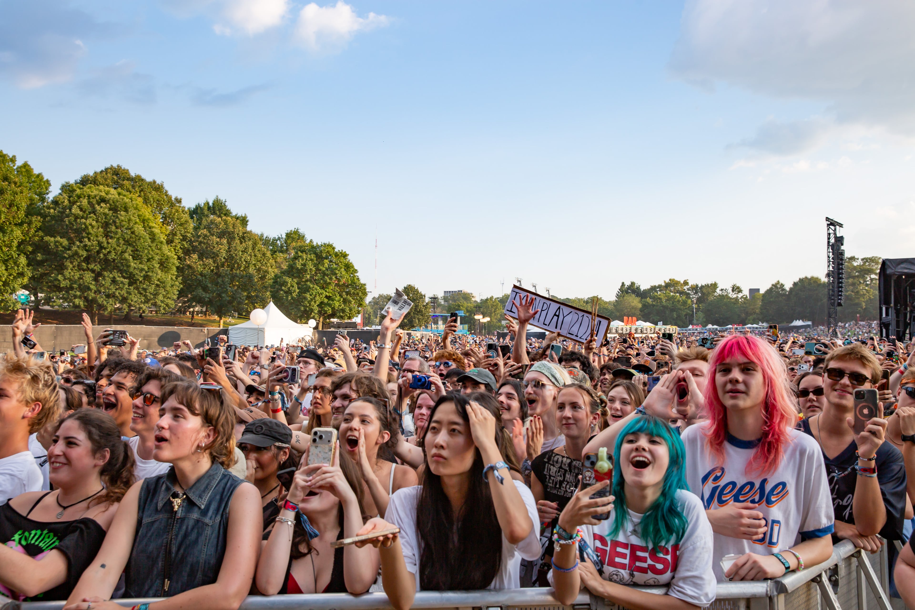 Indie rock band Geese drew a large crowd late Friday, Sept. 18, 2026, despite the high temperatures at Shaky Knees in Piedmont Park, Atlanta. (Ryan Fleisher for the AJC)