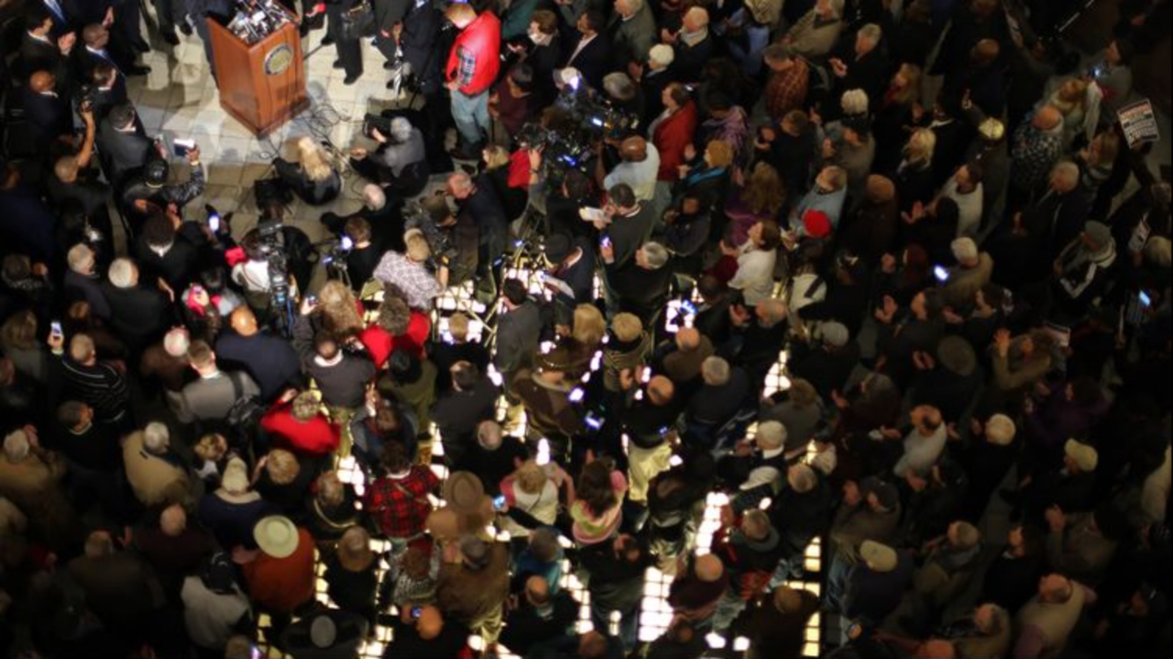 An overflow crowd fills the Capitol Rotunda as fired Atlanta Fire Chief Kelvin Cochran addresses supporters Tuesday. AJC Photo / Ben Gray
