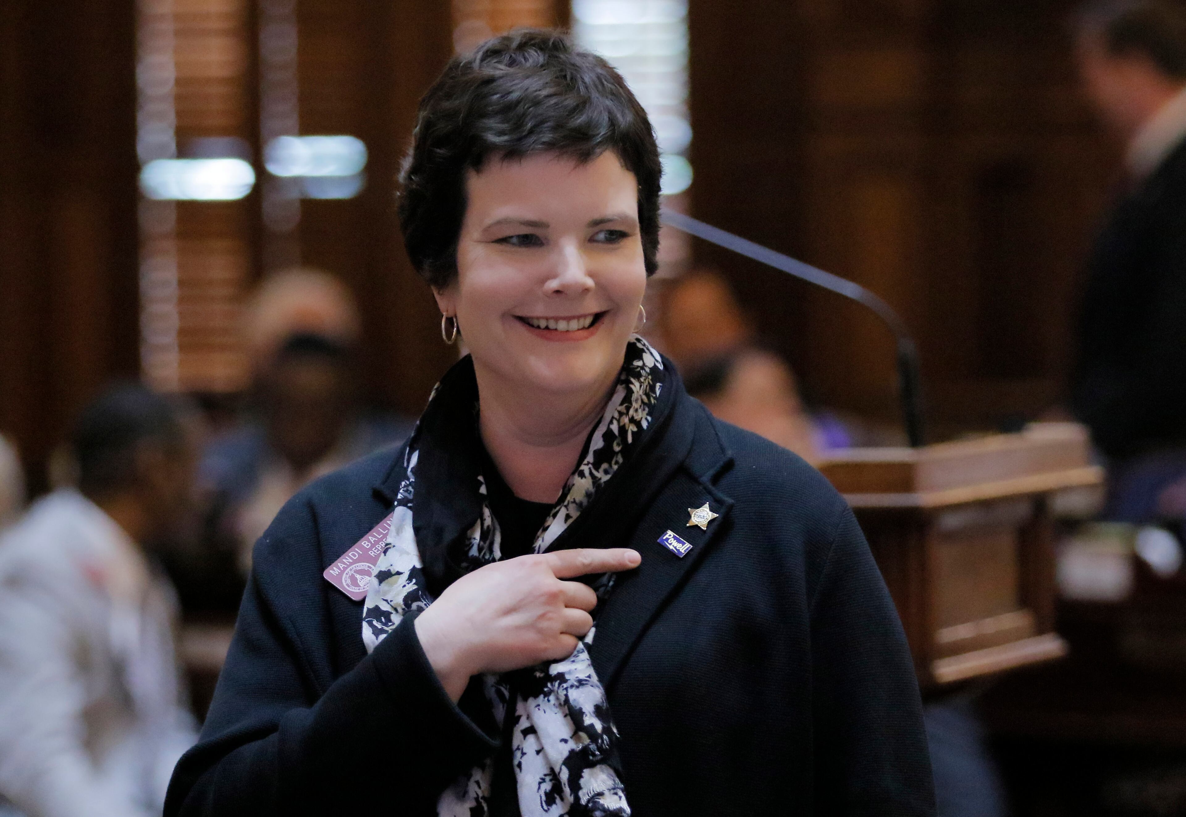 Mar. 30, 2017 - Atlanta - Rep. Mandi L. Ballinger, R - Canton, points to her new rules committee badge after the house insisted on it's version of the "Campus Carry" legislation which she sponsored. The 40th and final legislative day of the 2017 General Assembly. BOB ANDRES /BANDRES@AJC.COM