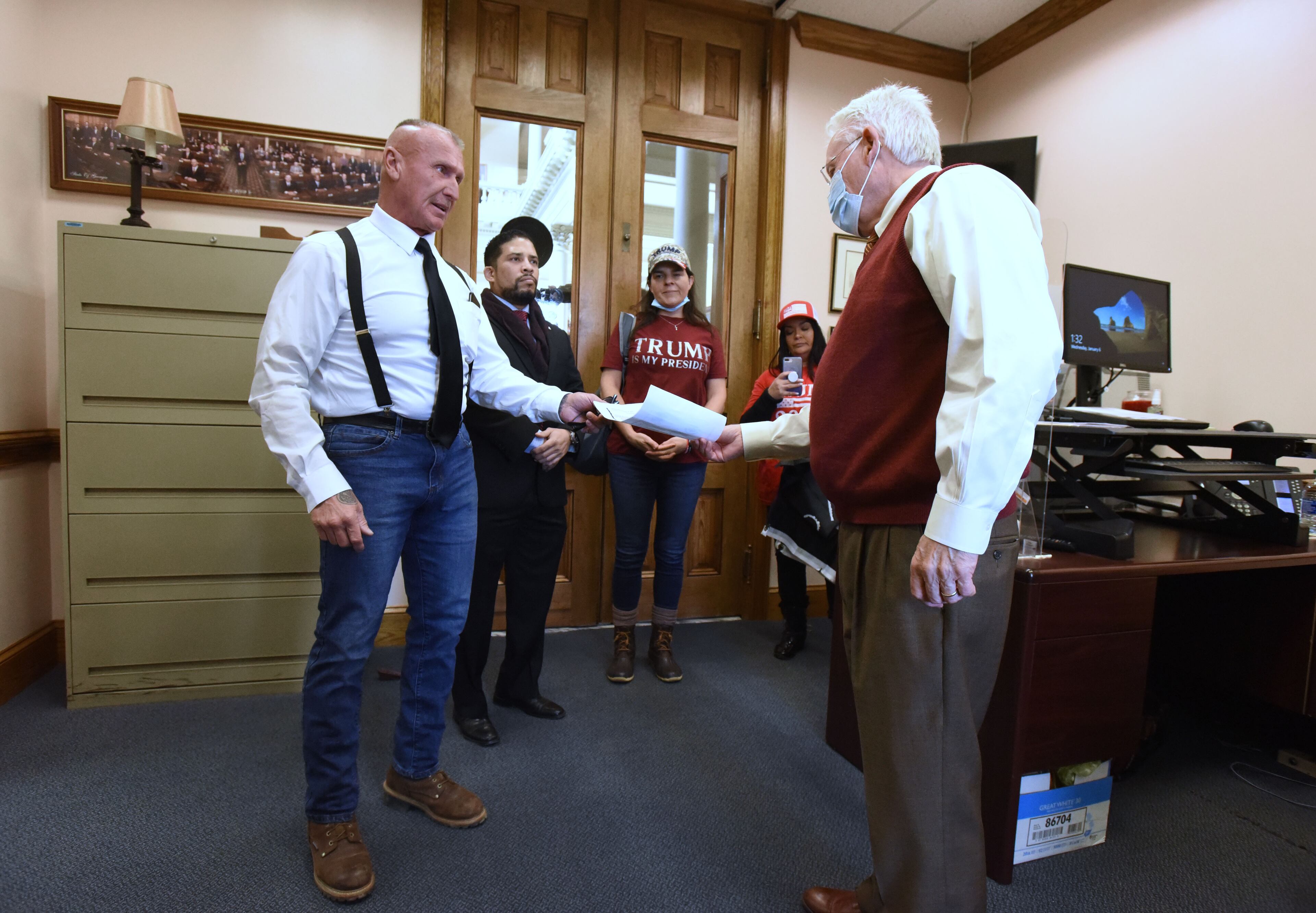 January 6, 20201 Atlanta - Former Ku Klux Klan leader and current American Patriots USA leader Chester Doles and Jonathan Garcia (left), delivers a letter to the office of Georgia Senate Secretary of the Senate at the Georgia State Capitol on Wednesday, January 6, 2021. (Hyosub Shin / Hyosub.Shin@ajc.com)