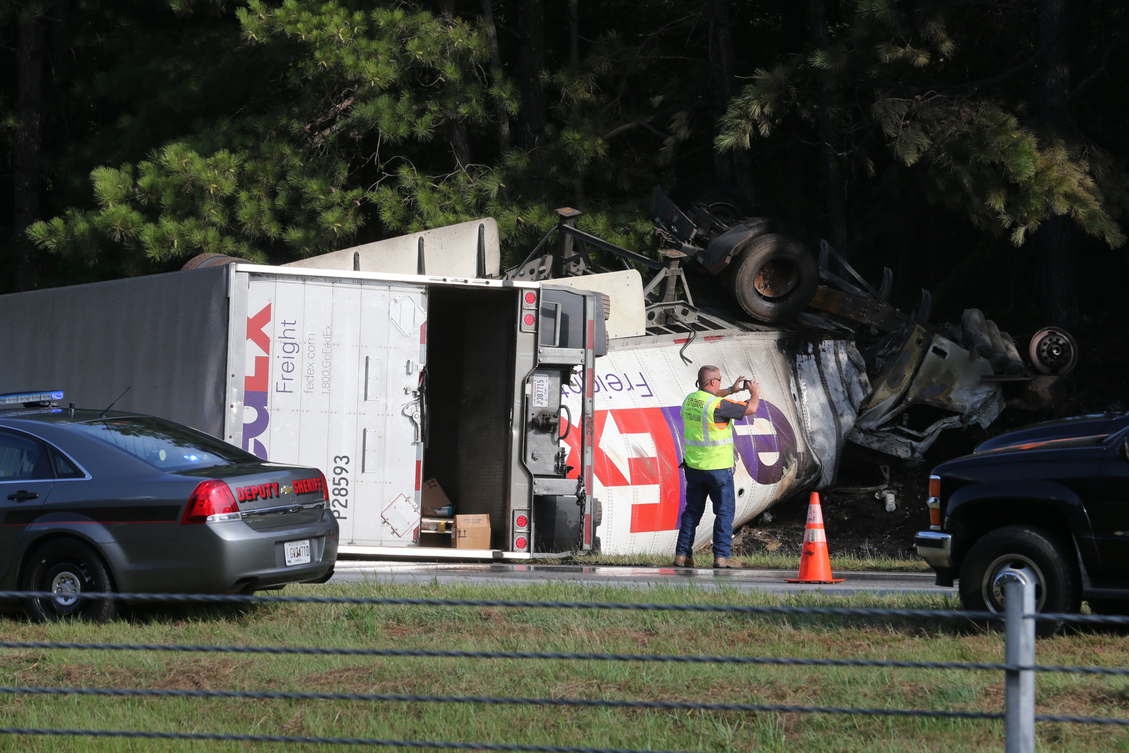 All westbound lanes of I-20 in west Georgia were shut down for about three hours Wednesday morning because of a fiery wreck involving a tractor-trailer and a bus, but one lane has now reopened. JOHN SPINK/JSPINK@AJC.COM