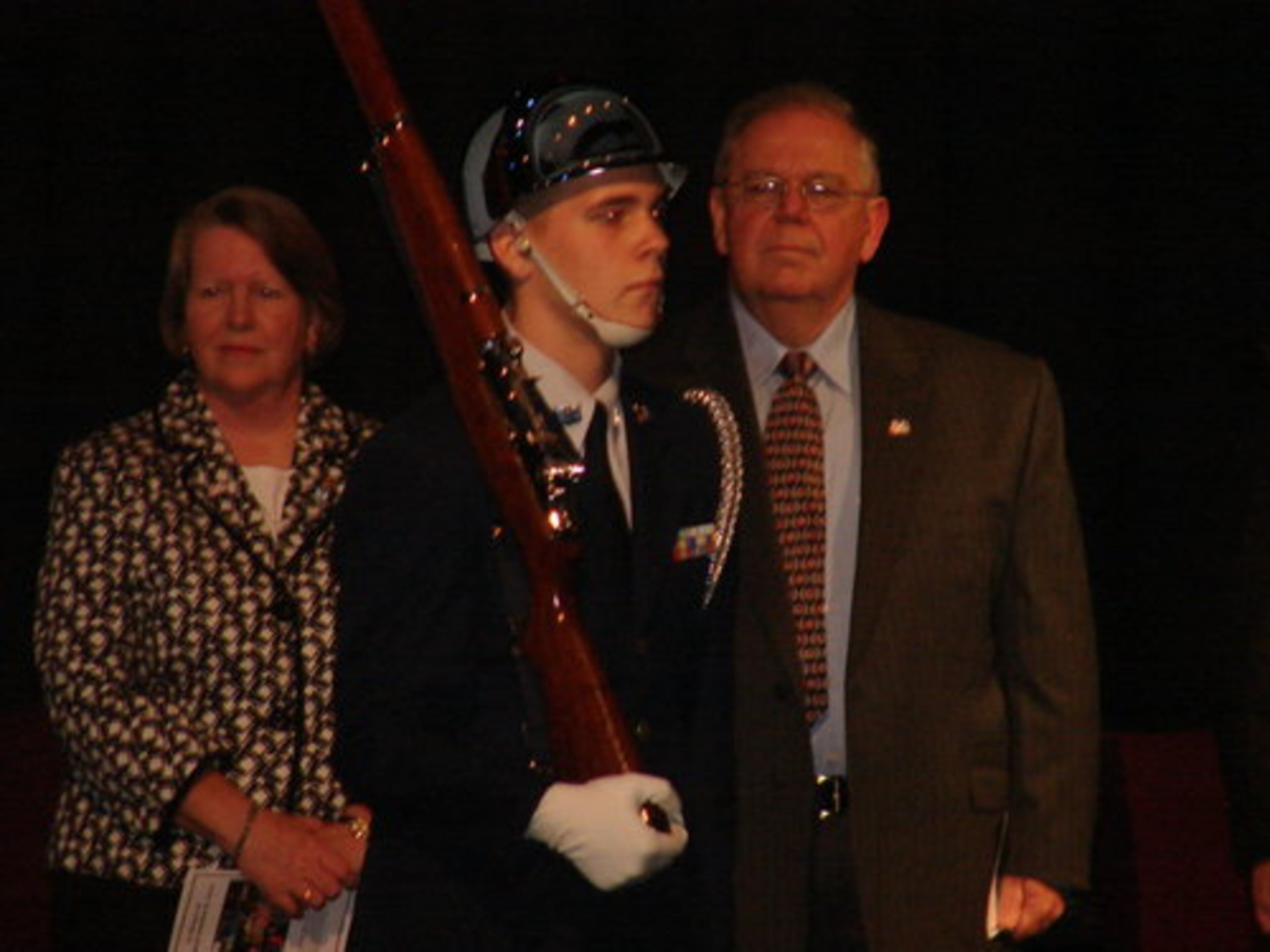 The parents of Cpl. Ayers, 24, watch a member of the Shiloh JROTC color guard. A speaker at Sunday's event said their son took the Army's "Be all you can be" motto to "Give all that you can give."