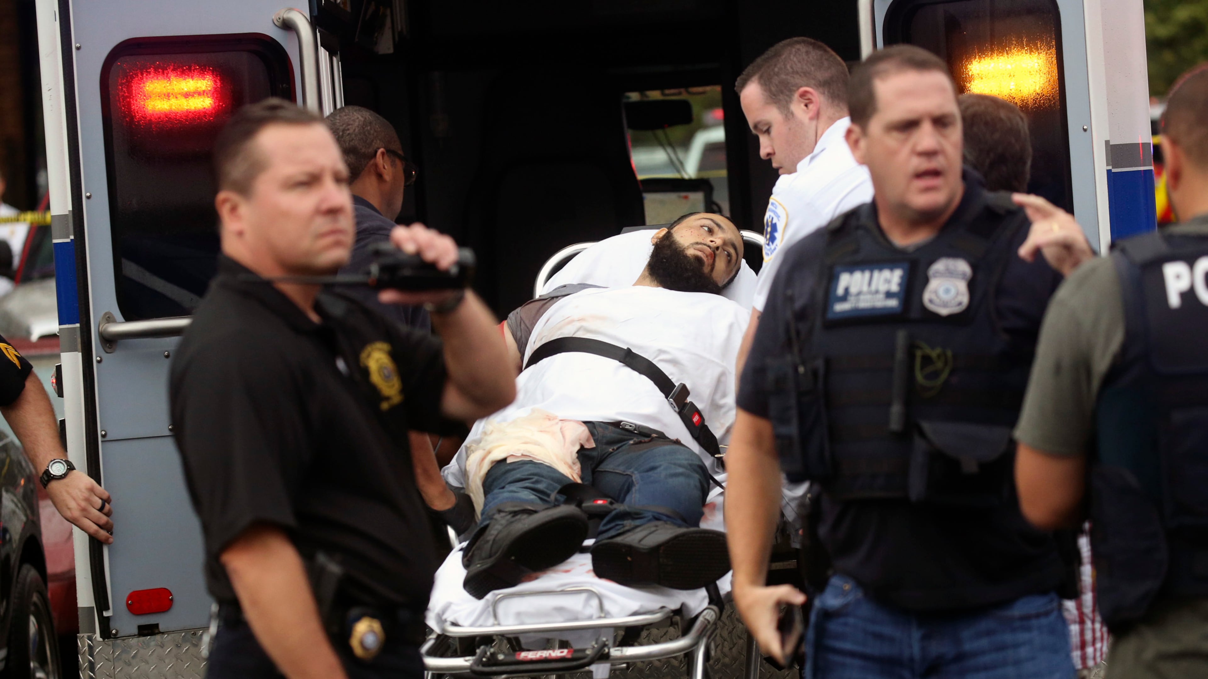 Ahmad Khan Rahami is taken into custody after a shootout with police Monday, Sept. 19, 2016, in Linden, N.J. Rahami was wanted for questioning in the bombings that rocked the Chelsea neighborhood of New York and the New Jersey shore town of Seaside Park. (Nicolaus Czarnecki/Boston Herald via AP)