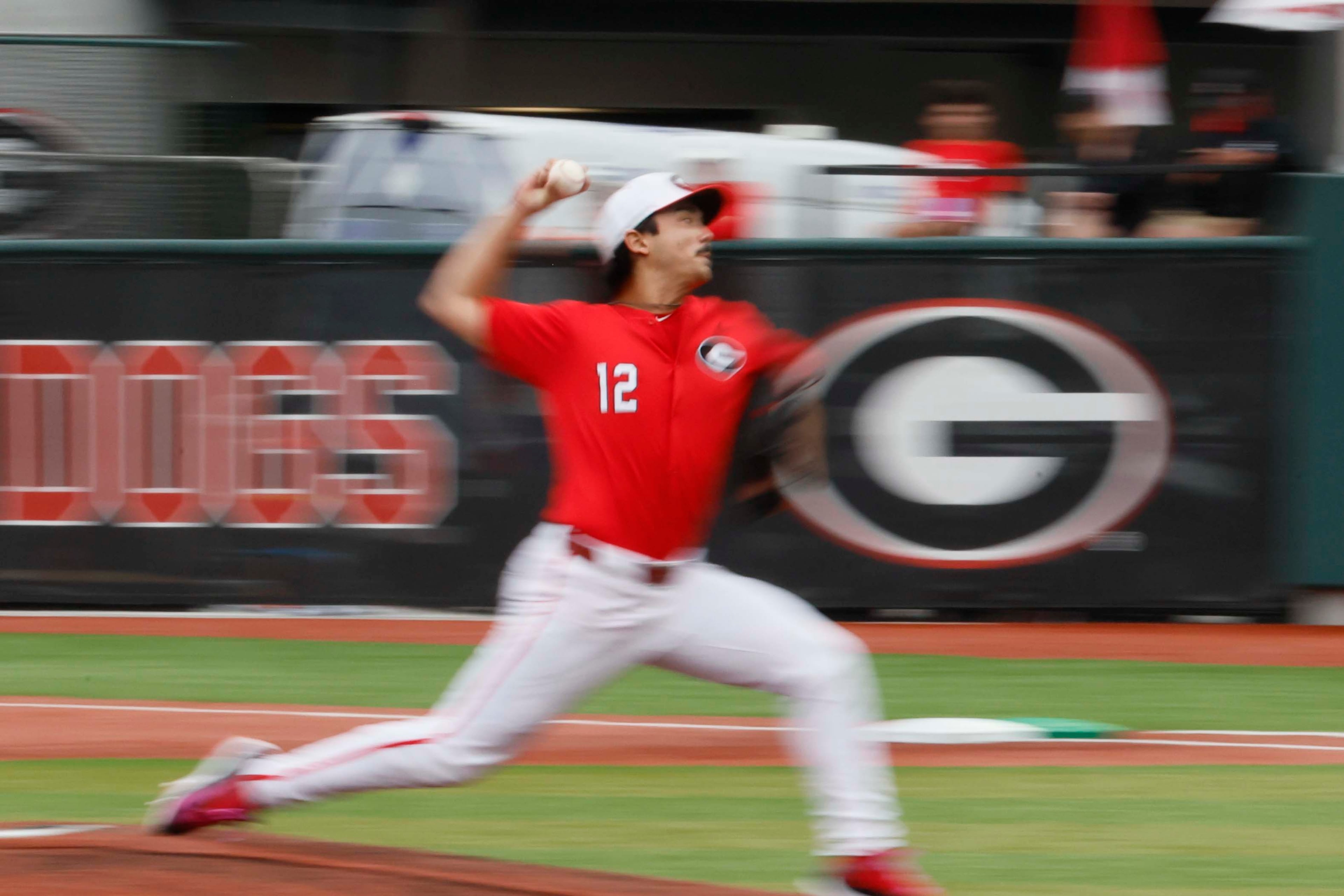 Georgia Bulldogs pitcher Caden Aoki (12) delivers a pitch during the first inning of their NCAA Regional final game at Foley Field on Sunday, May 31, 2026, in Athens. (Miguel Martinez/AJC)
