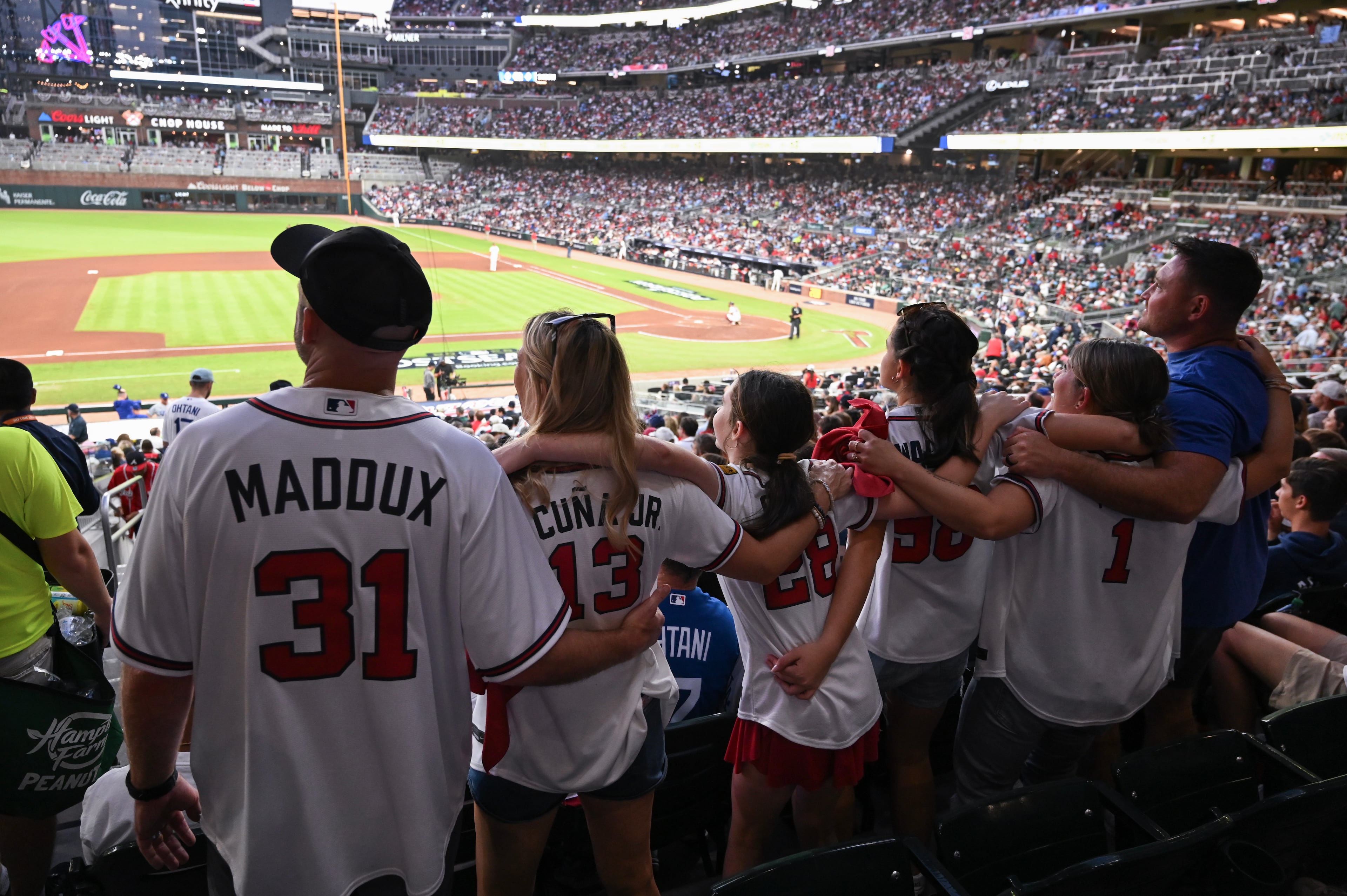 Fan cheer during the third inning of Game 4 of the MLB National League Division Series between the Atlanta Braves and the Los Angeles Dodgers, Wednesday, Oct. 7, 2026, in Atlanta. (Hyosub Shin/AJC)